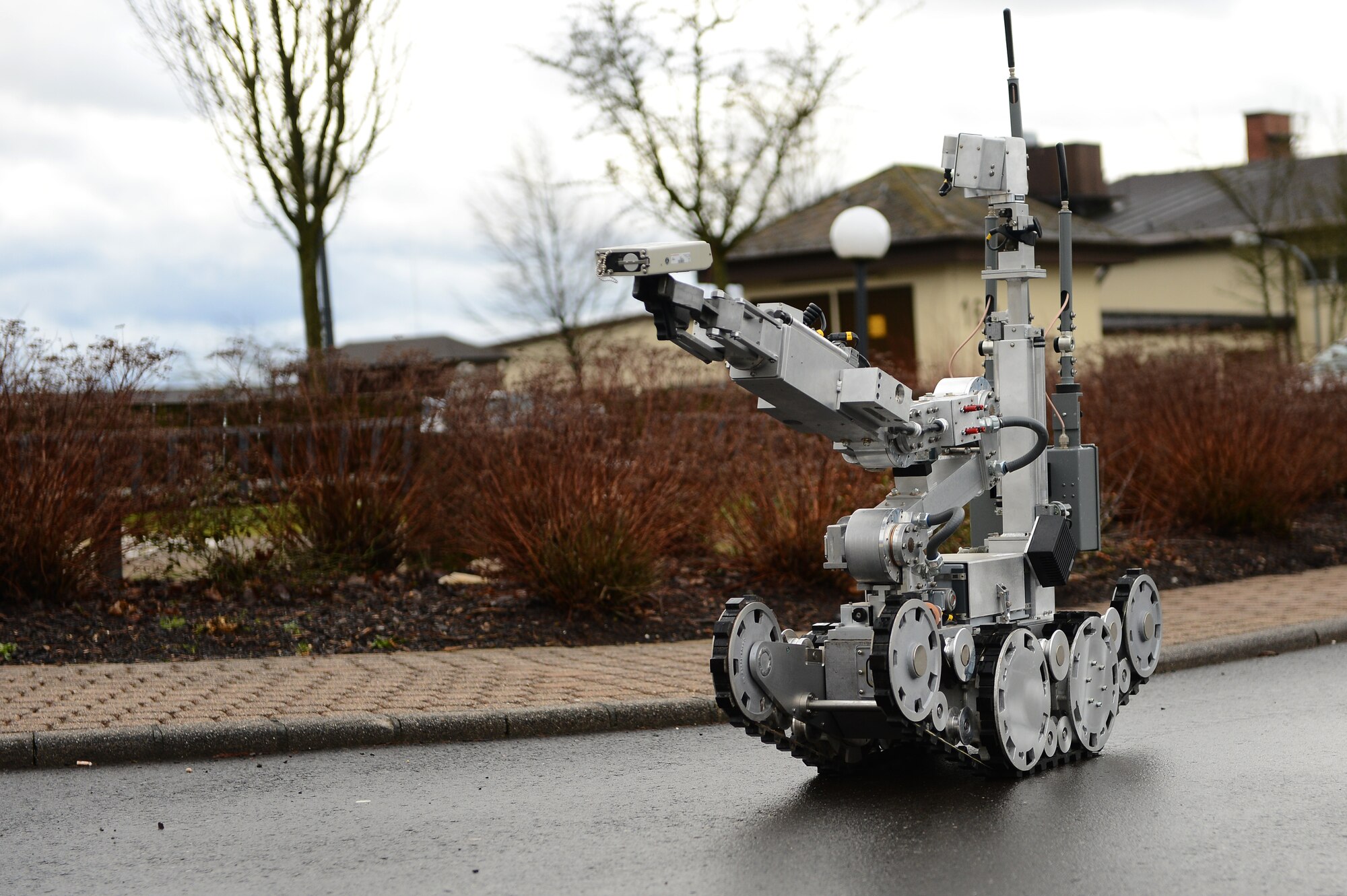 SPANGDAHLEM AIR BASE, Germany – A robot from the 52nd Civil Engineer Squadron Explosive Ordnance Disposal Flight searches for a suspicious package outside the base library Feb. 5, 2013. The EOD team uses various robots to gather information during incidents involving explosives and other hazardous materials to keep Airmen safe. (U.S. Air Force photo by Senior Airman Dillon Davis/Released)