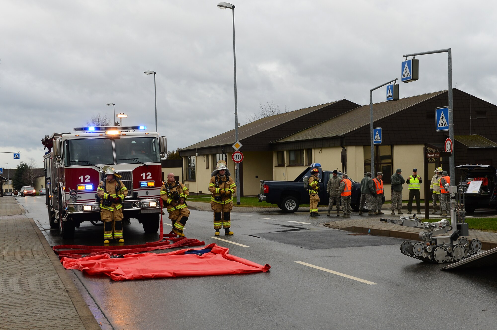 SPANGDAHLEM AIR BASE, Germany – First responders from the 52nd Fighter Wing coordinate with one another to properly dispose of a suspicious package during a base exercise Feb. 5, 2013. The exercise tests the skills of the base’s response centers to ensure continuous readiness. (U.S. Air Force photo by Senior Airman Dillon Davis/Released)