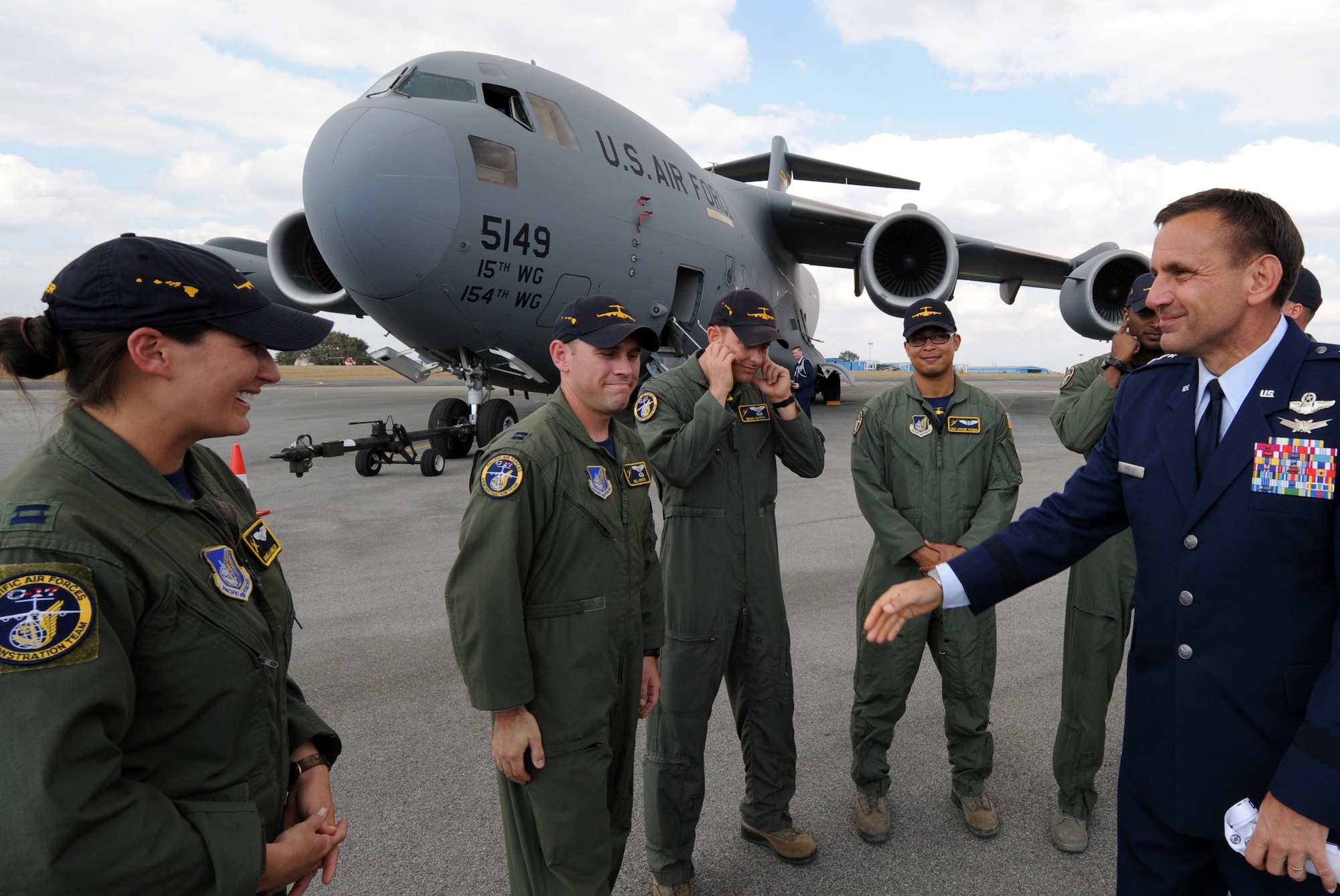 Lt. Gen. Stanley T. Kresge, Pacific Air Forces vice commander, greets Capt. Angela Kimler of the PACAF C-17 demonstration team at the Aero India 2013 air show at Air Force Station Yelahanka, Bangalore, India, Feb. 6. The air show allowed the crew of the C-17 to interact with numerous members of international militaries and discuss the capabilities of their aircraft. The U.S. military was represented by a F-16 demonstration team and a KC-135 static display in addition to the C-17. (U.S. Air Force photo by Capt. Ben Sakrisson)