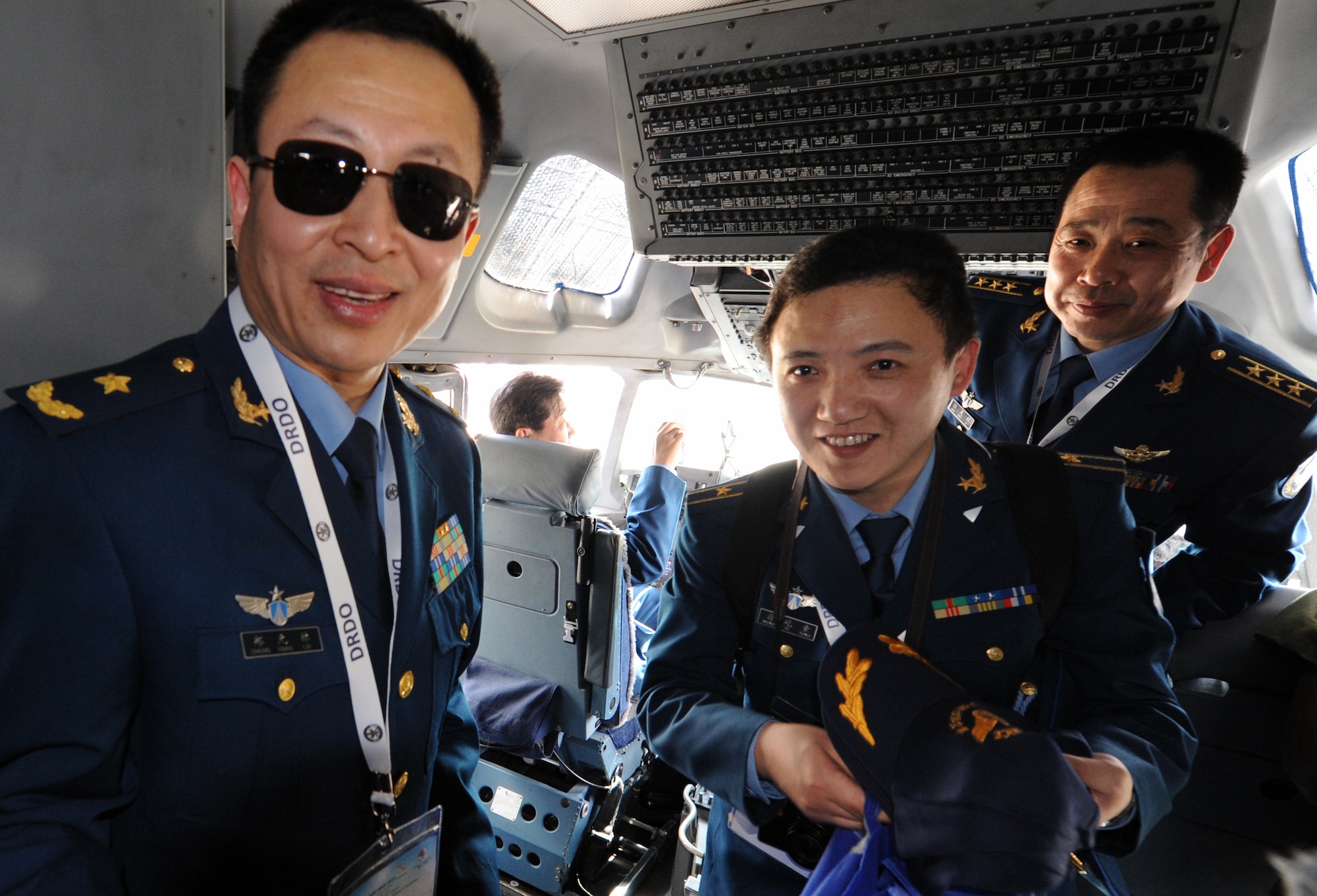 Members of the Chinese delegation to the Aero India 2013 air show tour the cockpit of a Pacific Air Forces C-17 Globemaster III demonstration aircraft at Air Force Station Yelahanka, Bangalore, India, Feb. 6. The air show allowed the crew of the C-17 to interact with numerous members of international militaries and discuss the capabilities of their aircraft. The U.S. military was represented by a F-16 demonstration team and a KC-135 static display in addition to the C-17. (U.S. Air Force photo by Capt. Ben Sakrisson)