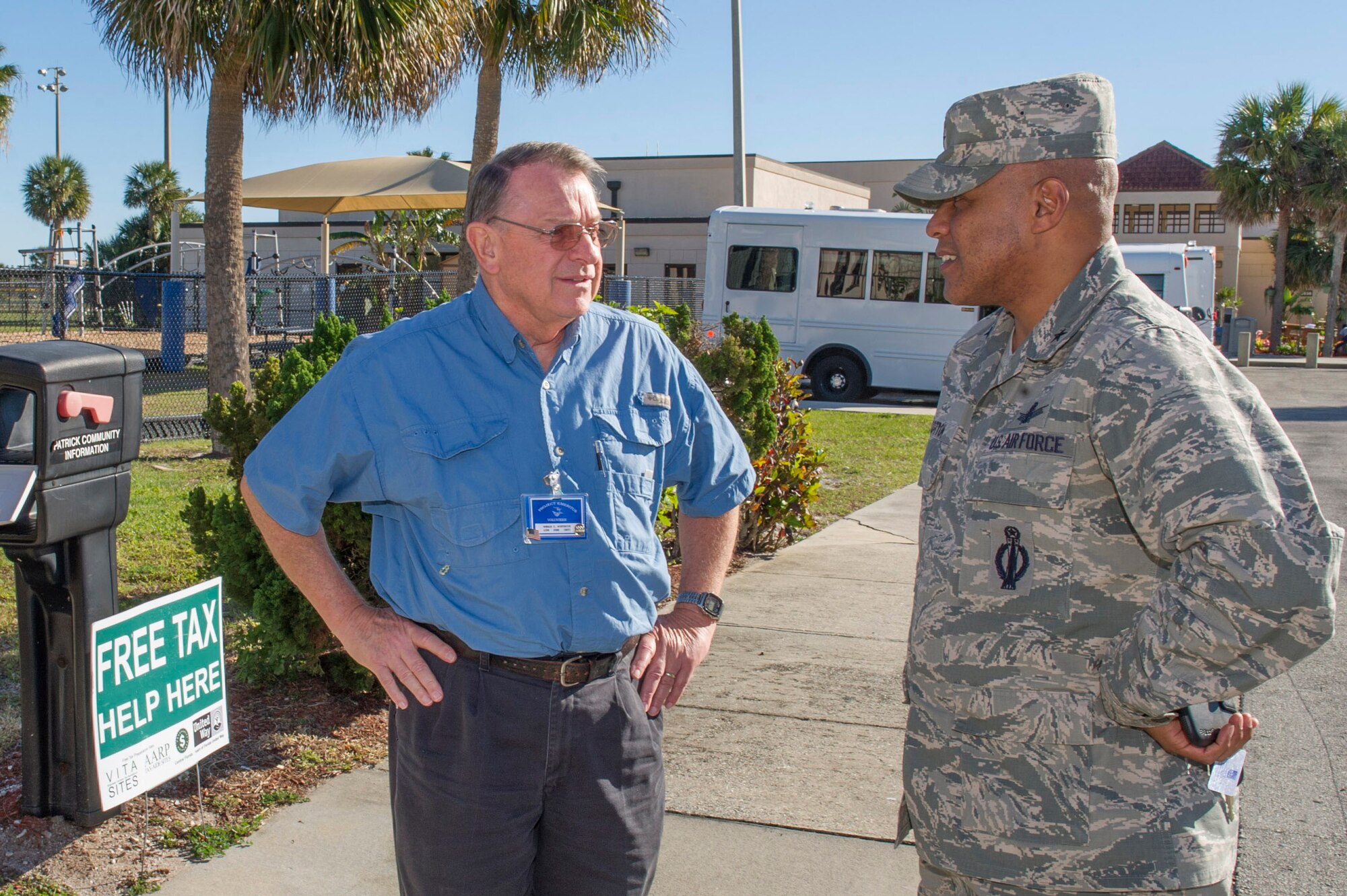Brig. Gen. Anthony Cotton, commander, 45th Space Wing, chats with Don
Winterich about the PAFB Volunteer Income Tax Assistance (VITA) Program. The
VITA program offers a great, no-cost alternative to other commercial
preparers. The tax return preparation assistance service is only available
by appointment Monday through Friday, from 9 a.m. to 5 p.m. To make an
appointment, call 494-4718.  
