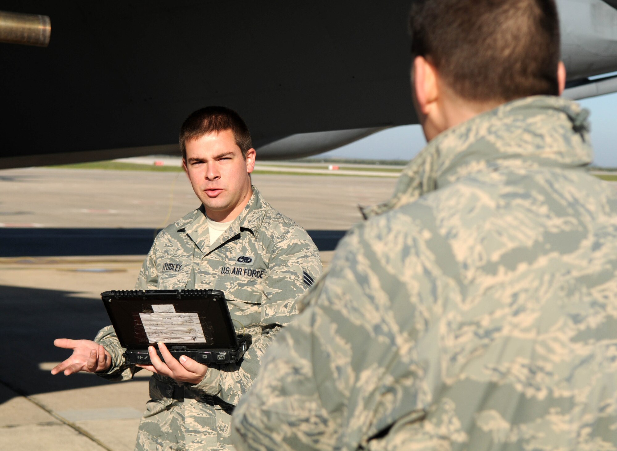Senior Airman William Studley, 100th Aircraft Maintenance Squadron electrical and environmental specialist and Greeley, Colo., native, explains his job to Chief Master Sgt. Tracy Jones, 100th Air Refueling Wing command chief master sergeant, Feb. 6, 2013, at a base in southwest Europe. The newly appointed command chief accompanied Col. Christopher Kulas, 100th ARW commander, to the deployed base for a jet swap and took the opportunity to visit Airmen deployed from RAF Mildenhall, England, in support of French operations in Mali. (U.S. Air Force photo by Staff Sgt. Austin M. May)