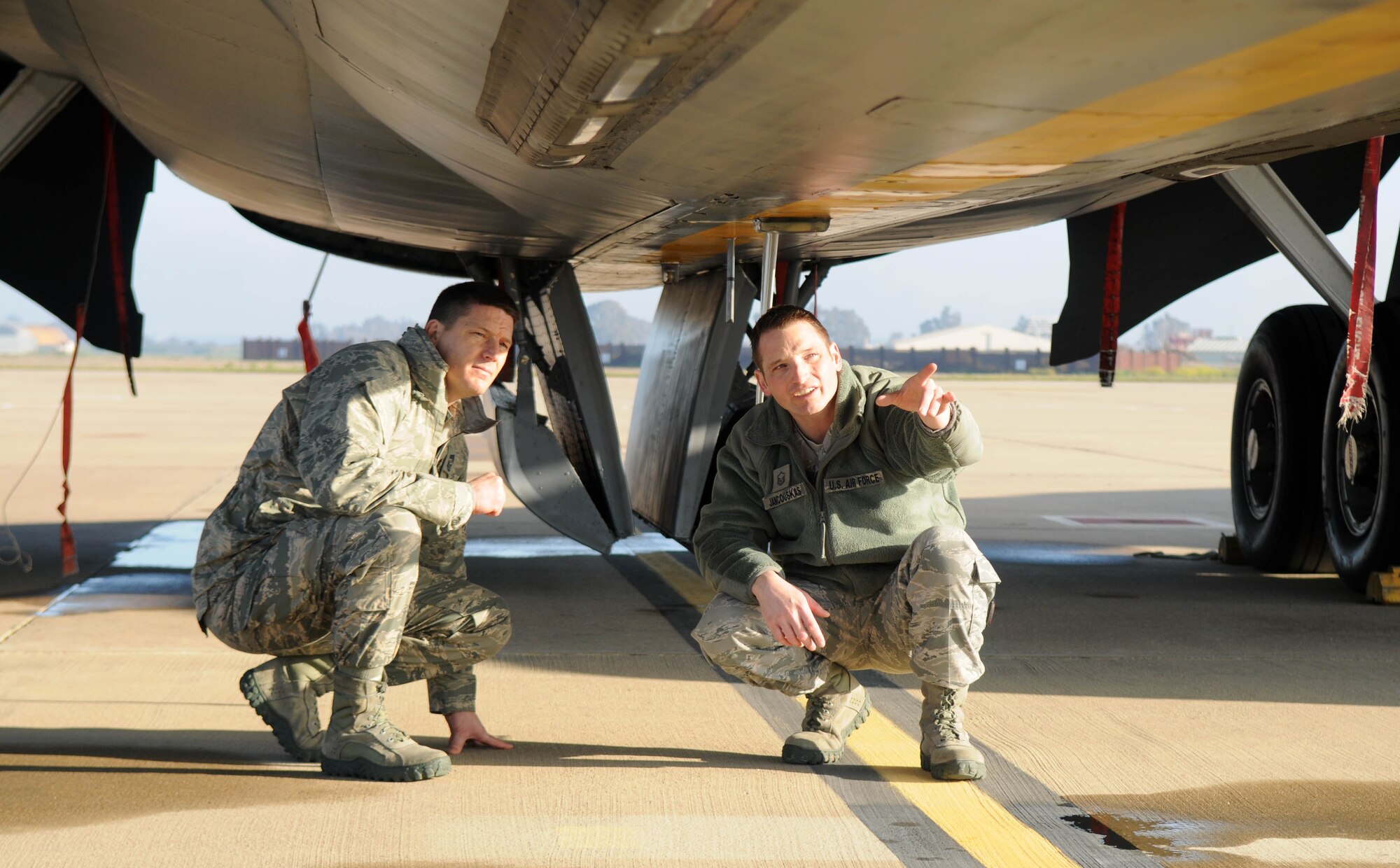 Master Sgt. William Jancouskas (right), 100th Aircraft Maintenance Squadron production superintendent and Castle Rock, Colo., native, shows Chief Master Sgt. Tracy Jones, 100th Air Refueling Wing command chief master sergeant, around a KC-135 Stratotanker at a base in southwest Europe. The newly appointed command chief accompanied Col. Christopher Kulas, 100th ARW commander, to the deployed base for a jet swap and took the opportunity to visit Airmen deployed from RAF Mildenhall, England, in support of French operations in Mali. (U.S. Air Force photo by Staff Sgt. Austin M. May)
