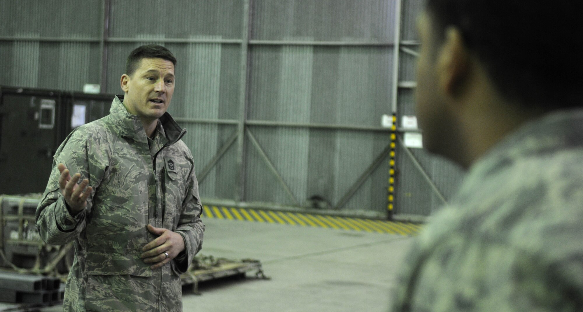 Chief Master Sgt. Tracy Jones, 100th Air Refueling Wing command chief master sergeant, addresses Airmen during morning role call Feb. 6, 2013. The Airmen are deployed to southwest Europe from RAF Mildenhall, England, in support of French operations in Mali. The newly appointed command chief accompanied Col. Christopher Kulas, 100th ARW commander, to the deployed base for a jet swap and took the opportunity to meet the Airmen he will lead at home. (U.S. Air Force photo by Staff Sgt. Austin M. May)