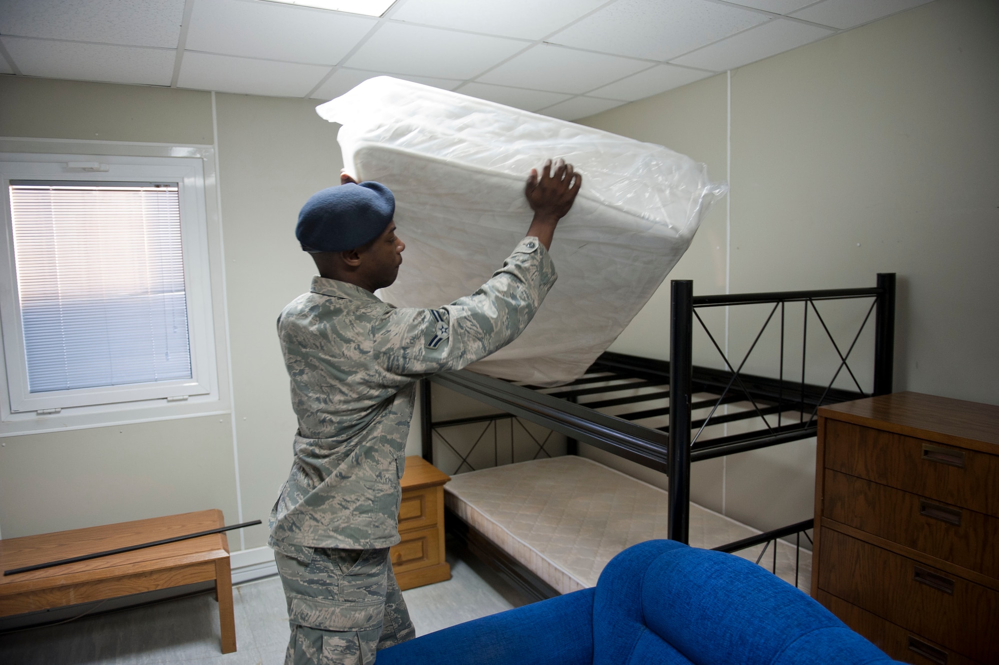 Airman 1st Class Darryl Davis, 39th Security Forces Squadron, ensures a bed frame in Patriot Village is properly assembled to meet the need of transiting or deployed service members Jan. 9, 2013, at Incirlik Air Base, Turkey. Currently, Patriot Village is housing soldiers supporting NATO's deployment of Patriot missile batteries. (U.S. Air Force photo by Senior Airman Clayton Lenhardt/Released)