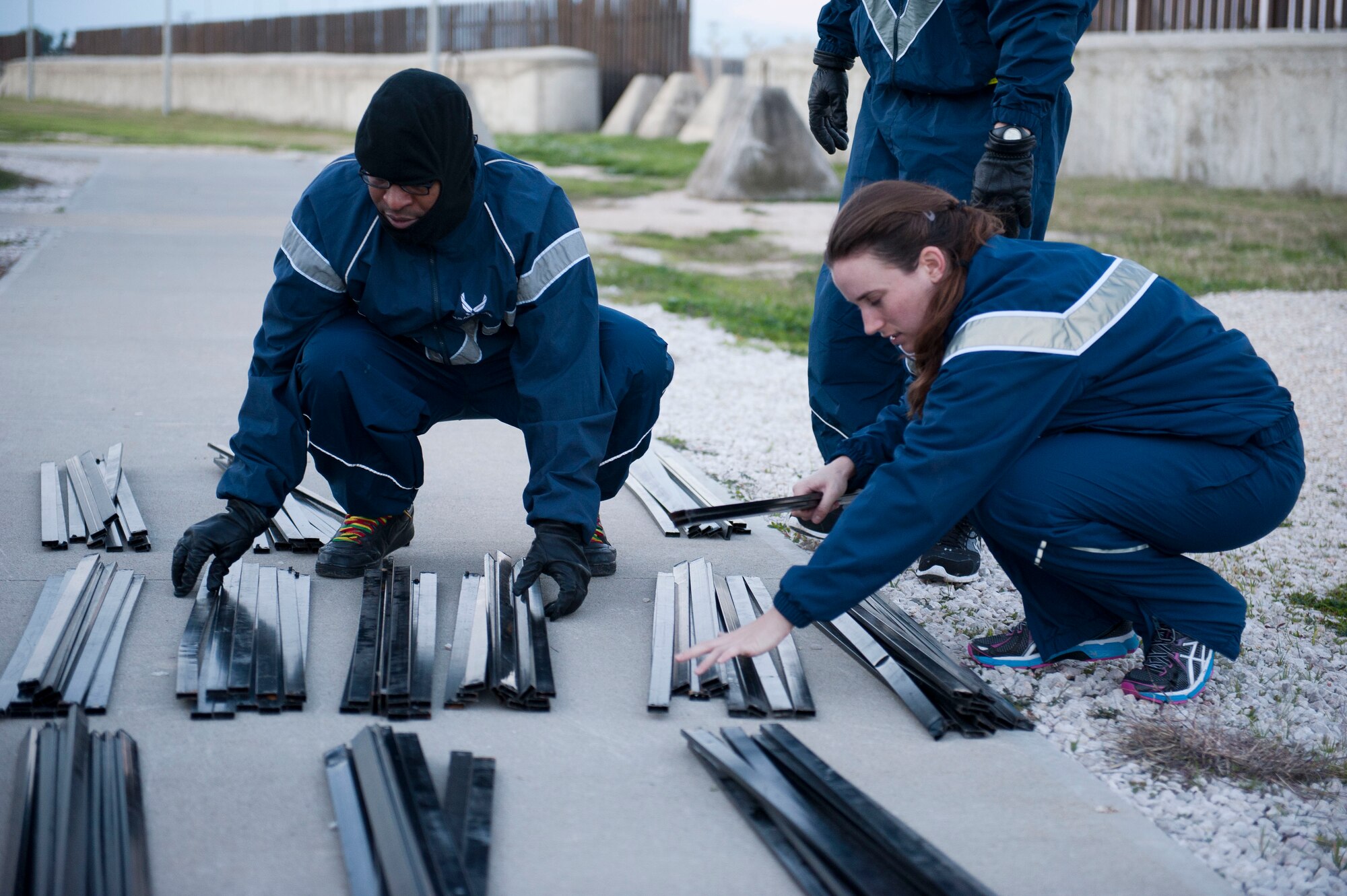 Master Sgt. Paul Ingleton, 39th Civil Engineer Squadron, and Capt. Amanda Pelkowski, 39th Force Support Squadron, organize bed frame pieces to ensure Patriot Village meets the need of transiting or deployed service members Jan. 9, 2013, at Incirlik Air Base, Turkey. Patriot Village is a temporary lodging location at Incirlik that can house more than 1,800 people. (U.S. Air Force photo by Senior Airman Clayton Lenhardt/Released)