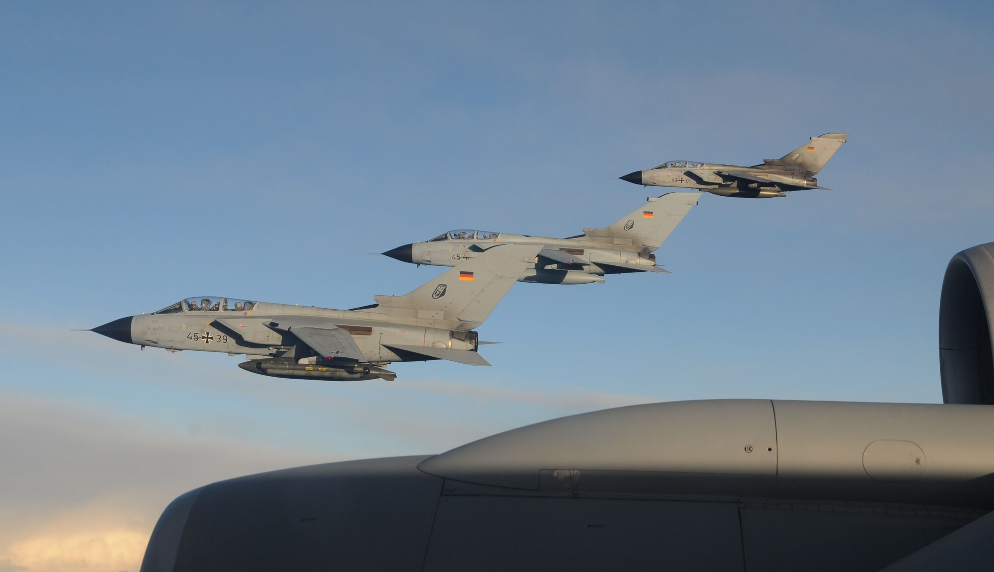 Three Tornado PA-200 from Buechel Air Base, Germany, fly beside a KC-135R Stratotanker from the 100th Air Refueling Wing, RAF Mildenhall, England, after receiving fuel Feb. 5, 2013, over Germany. Five aircraft received a total of 15,600 pounds of fuel before continuing their training mission. (U. S. Air Force photo by Master Sgt. Latisha Cole/Released)