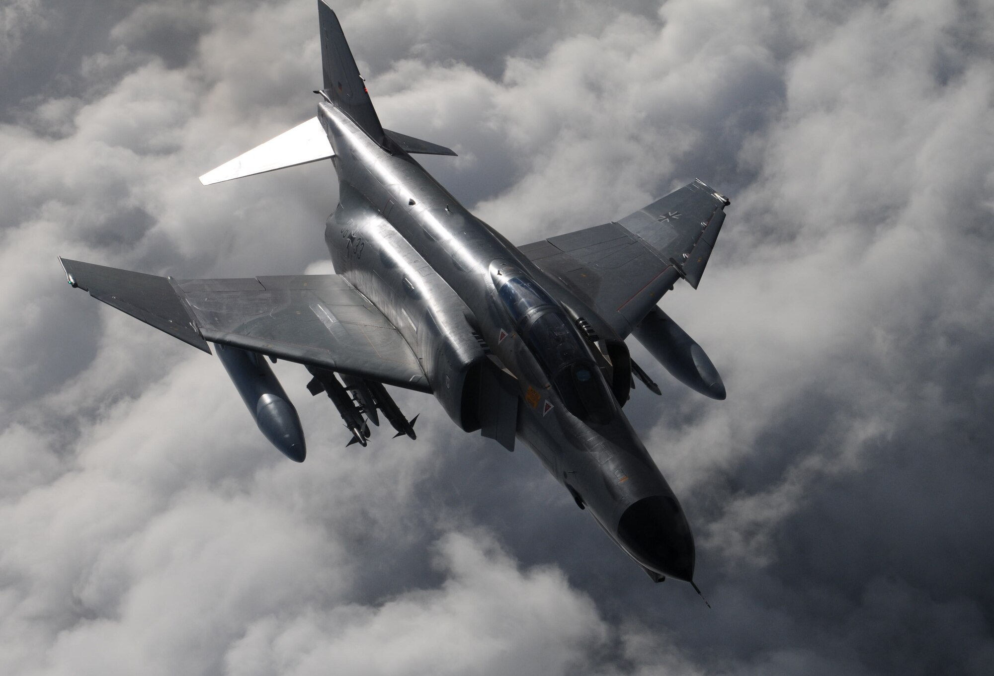 An F-4 Phantom from Wittmund Air Base, Germany, flies beside a KC-135R Stratotanker from the 100th Air Refueling Wing, RAF Mildenhall, England, during a training mission Feb. 5, 2013, over Germany. Both the F-4 and the KC-135 platforms have been used by air forces worldwide since before the Vietnam War. (U. S. Air Force photo by Master Sgt. Latisha Cole/Released)