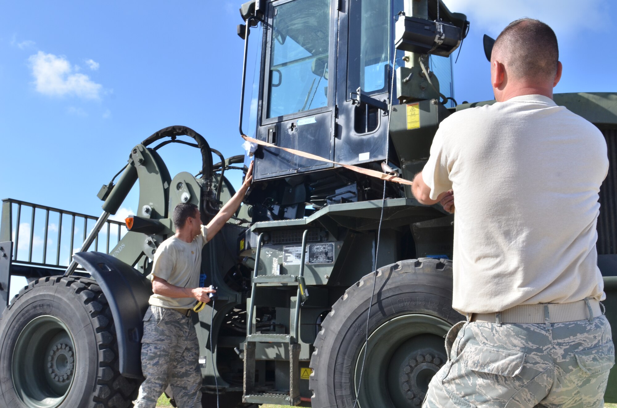 U.S. Air Force Airman from the 36th Mobility Response Squadron assemble the canopy of a forklift during exercise Cope North 2013 on Tinian Airfield Feb. 5, 2013. Cope North is a multilateral aerial exercise, held once or twice yearly, designed to increase the combat readiness and interoperability of the U.S. Air Force, Japan Air Self-Defense Force, Royal Australian Air Force and other Pacific partner nations. (U.S. Air Force photo by Staff Sgt. Alex Montes/RELEASED)