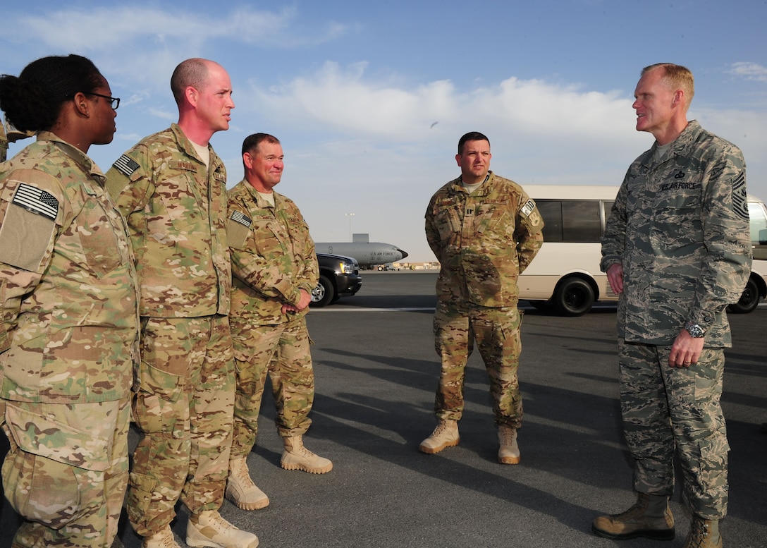 SOUTHWEST ASIA -- Chief Master Sgt. of the Air Force James Cody talks with explosive ordnance disposal Airmen of the 379th Expeditionary Civil Engineer Squadron during a visit to the 379th Air Expeditionary Wing. The visit is a part of a multi-base tour by Cody and Air Force Chief of Staff Gen. Mark A. Welsh III to meet with Airmen throughout the U.S. Central Command area of responsibility. (U.S. Air Force photo/Master Sgt. Brendan Kavanaugh)