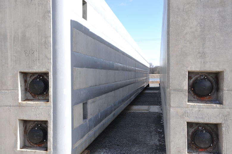 This 300-ton, 10-foot-by-10-foot by 113-foot lock approach wall beam was fabricated in Melbourne, Ky., moved 412 miles down the Ohio River and then 530 miles up the Tennessee River to Watts Bar Dam for assembly. Forty-two of these beams will be stored at Watts Bar for placement in the Chickamauga Lock Replacement Project when required for construction.  (USACE photo by Fred Tucker)
