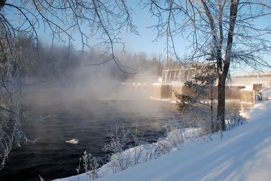 Steam rises from the Mississippi River around the Corps of Engineers, St. Paul District's Pokegama Dam during the winter. The dam and recreation area are located near Grand Rapids, Minn.