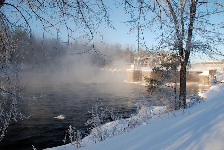 Steam rises from the Mississippi River around the Corps of Engineers, St. Paul District's Pokegama Dam during the winter. The dam and recreation area are located near Grand Rapids, Minn.