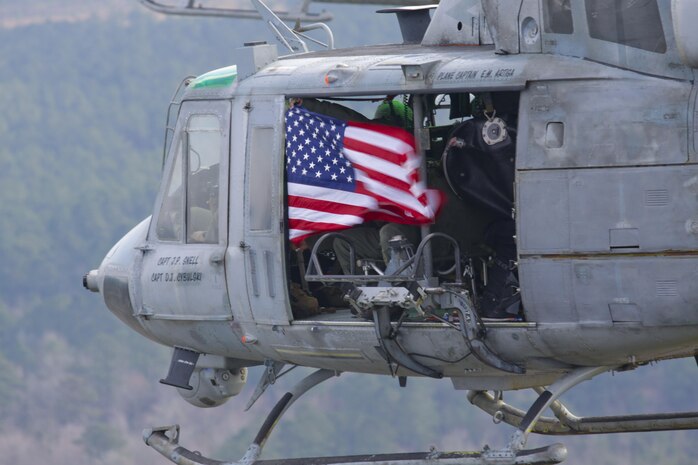 Marine Light Attack Helicopter Squadron 269 Marines bids fair winds and following seas to the UH-1N Huey on it final flight with the squadron with a parade across the skies of Marines Corps Air Station New River, Feb. 5.Two UH-1N Hueys were joined by its replacement a UH-1Y Huey and its partner in the sky, an AH-1W Cobra. After the flight, Col. Scott S. Jenson, Marine Aircraft Group 29 commanding officer, reflected on the history of the UH-1N Huey.  
