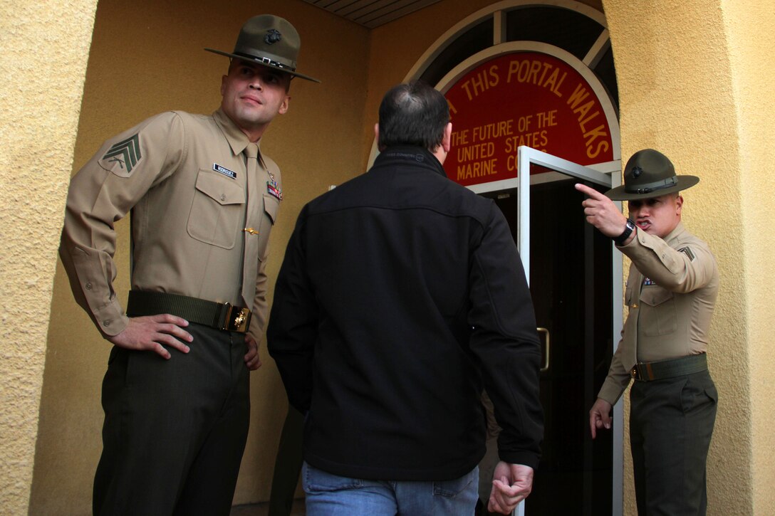 Educators from Recruiting Stations Twin Cities and Kansas City pass the infamous yellow footprints while participating in a receiving brief at Marine Corps Recruit Depot San Diego Jan. 29. For additional imagery from the event, visit www.facebook.com/rstwincities.