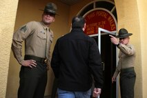 Educators from Recruiting Stations Twin Cities and Kansas City pass the infamous yellow footprints while participating in a receiving brief at Marine Corps Recruit Depot San Diego Jan. 29. For additional imagery from the event, visit www.facebook.com/rstwincities.