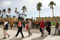 Recruiting Station Twin Cities' educators workshop participants pass recruits who are in the first phase of boot camp while touring Marine Corps Recruit Depot San Diego Jan. 29. For additional imagery from the event, visit www.facebook.com/rstwincities.