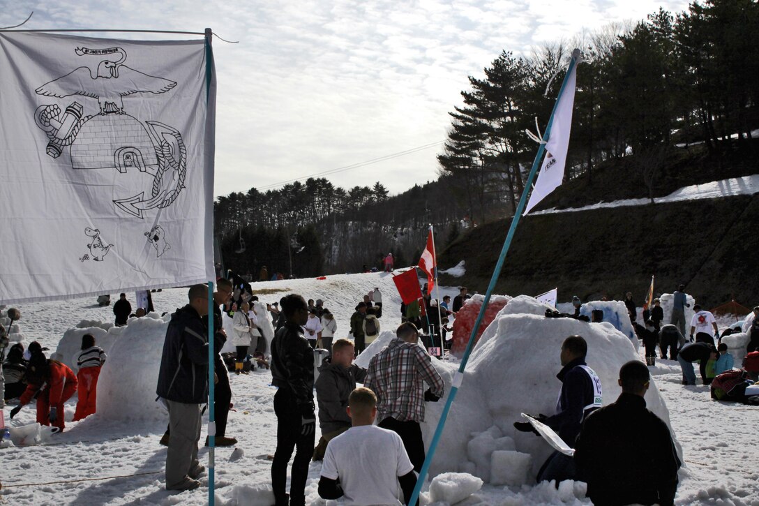Combat Logistics Company 36 Marines place the roof on their igloo during the First World Igloo Building Championship competition, which took place at the Osorakan Snow Park, located in the town of Akiota, Feb. 3, 2013. CLC-36 entered three teams into the event, two in the speed-building competition and one in the artistic competition.