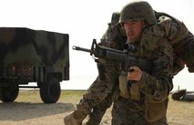 Lance Cpl. Hai Vang fireman carries a simulated casualty during the combat lifesaving portion of 3rd Supply Battalion’s supply management unit exercise Jan. 25 at Kin Blue Training Area near Camp Hansen. During the exercise, Marines received a refresher course on combat lifesaving skills. Vang is a warehouse clerk with 3rd Supply Battalion, Combat Logistics Regiment 35, 3rd Marine Logistics Group, III Marine Expeditionary Force.