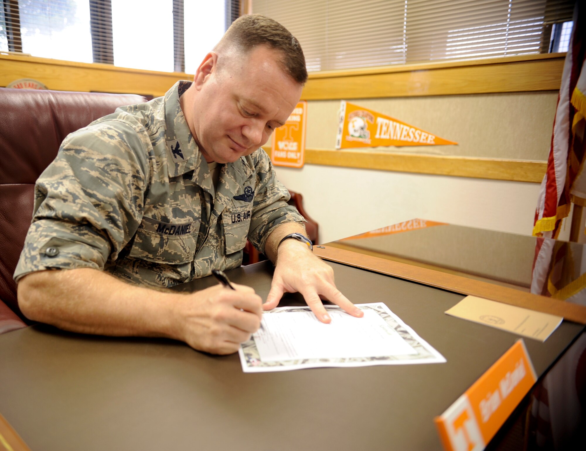 U.S. Air Force Col. Brian McDaniel, 18th Wing vice commander, signs the Military Saves Week proclamation at the 18th Wing headquarters building on Kadena Air Base, Japan, Feb. 6, 2013. Military Saves Week takes place Feb. 25 through March 2. (U.S. Air Force photo/Naoto Anazawa)