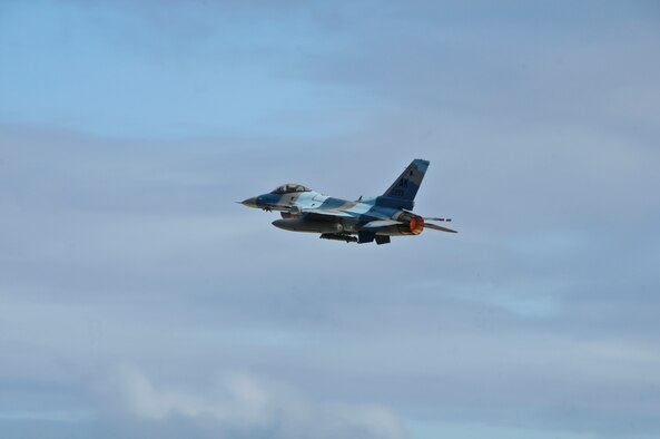 A U.S. Air Force F-16 Fighting Falcon from the 354th Fighter Wing, Eielson Air Force Base, Ala., flies over the Andersen Air Force, Base flight line during Cope North 2013, Feb. 7, 2013. Cope North is an annual air combat tactics, humanitarian assistance and disaster relief exercise designed to increase the readiness and interoperability of the U.S. Air Force, Japan Air Self-Defense Force and Royal Australian Air Force. (U.S. Air Force photo by Airman 1st Class Marianique Santos/RELEASED)