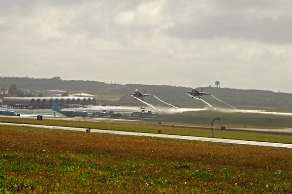 Royal Australian Air Force F/A-18 Hornets from the No. 3 Squadron, RAAF Base Williamtown, Australia, take off from the flight line at Andersen Air Force Base, Guam, during Cope North 2013, Feb. 7, 2013. Cope North is an annual air combat tactics, humanitarian assistance and disaster relief exercise designed to increase the readiness and interoperability of the U.S. Air Force, Japan Air Self-Defense Force and Royal Australian Air Force. (U.S. Air Force photo by Airman 1st Class Marianique Santos/RELEASED)