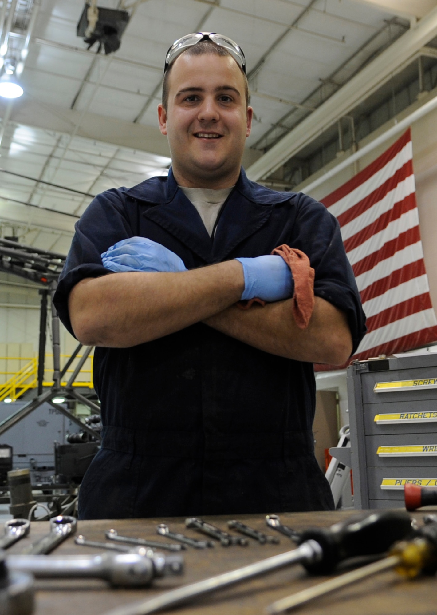 WHITEMAN AIR FORCE BASE, MO. – – Staff Sgt. Cole Adams, 509th Maintenance Squadron aerospace ground equipment mechanic, services, inspects and troubleshoots engine-driven generator sets, hydraulic test stands, air compressors and bomb lifts, here Jan. 31. With budget cuts happening Air Force-wide, finding a way to get the job done with limited resources is what Adams does often. He solved an equipment shortfall by writing an engineering technical assistance securing parts for a bomb lift. (U.S. Air Force photo/Staff Sgt. Alexandra M. Boutte) (RELEASED)
