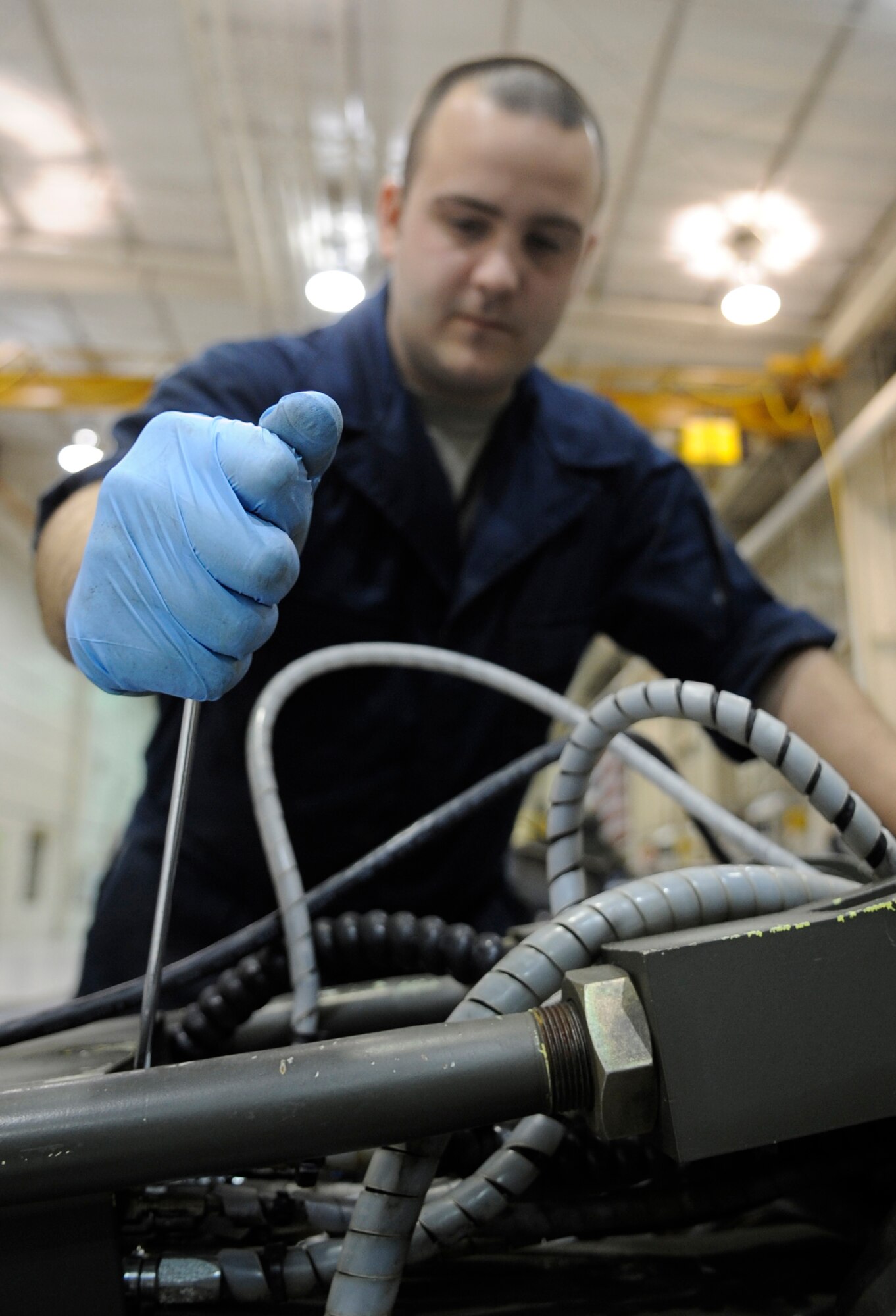 WHITEMAN AIR FORCE BASE, MO. – Staff Sgt. Cole Adams, 509th Maintenance Squadron aerospace ground equipment mechanic, ensures everything works properly on the MHU-83 bomb lift, also known as a Jammer, here Jan. 31. Bomb lifts are a self-propelled munitions handling unit with a diesel driven hydrostatic system. Jammers are Adams favorite piece of equipment to work on. (U.S. Air Force photo/Staff Sgt. Alexandra M. Boutte) (RELEASED)