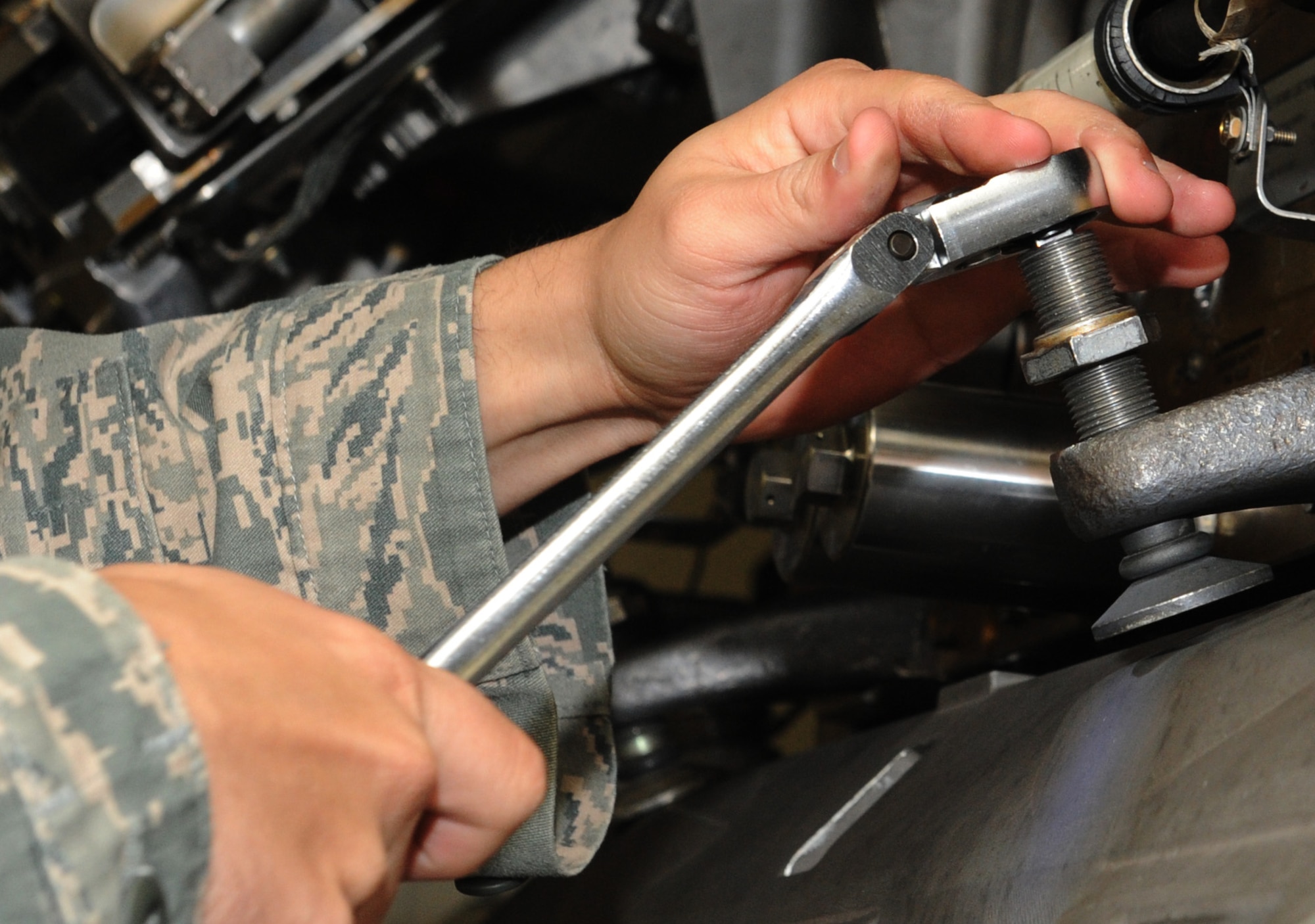 WHITEMAN AIR FORCE BASE, Mo -- Tech. Sgt. Johnathan Haynes, 131st Aircraft Maintenance Squadron load crew member, ensures that a mock GBU-31 is properly swayed into position. The load crew competed in the Load Crew of the Year competition. The four-man team competed in a 45-minute timed load, dress and appearance, and a 25-question written test.  (U.S. Air Force photo/Airman 1st Class Bryan Crane)