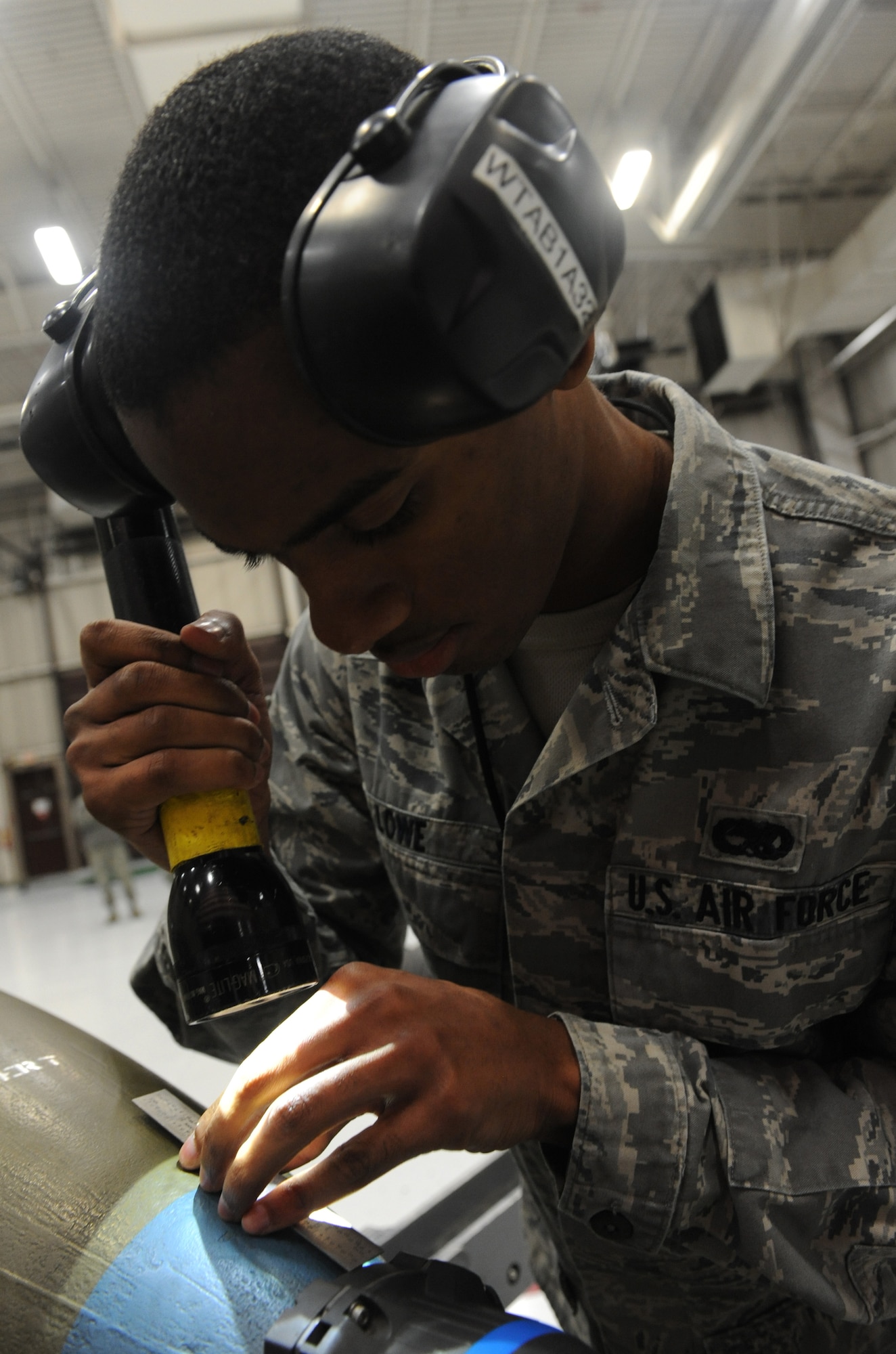 WHITEMAN AIR FORCE BASE, Mo -- Airman 1st Class Keandre Lowe, 509th Aircraft Maintenance Squadron 13th Ammunitions load crew member, inspects a mock GBU-31 for serviceability, Jan. 25. The load crew competed in the Load Crew of the Year competition. The winners will be announced at the 2013 Maintenance Professional of the Year banquet. (U.S. Air Force photo/Airman 1st Class Bryan Crane)