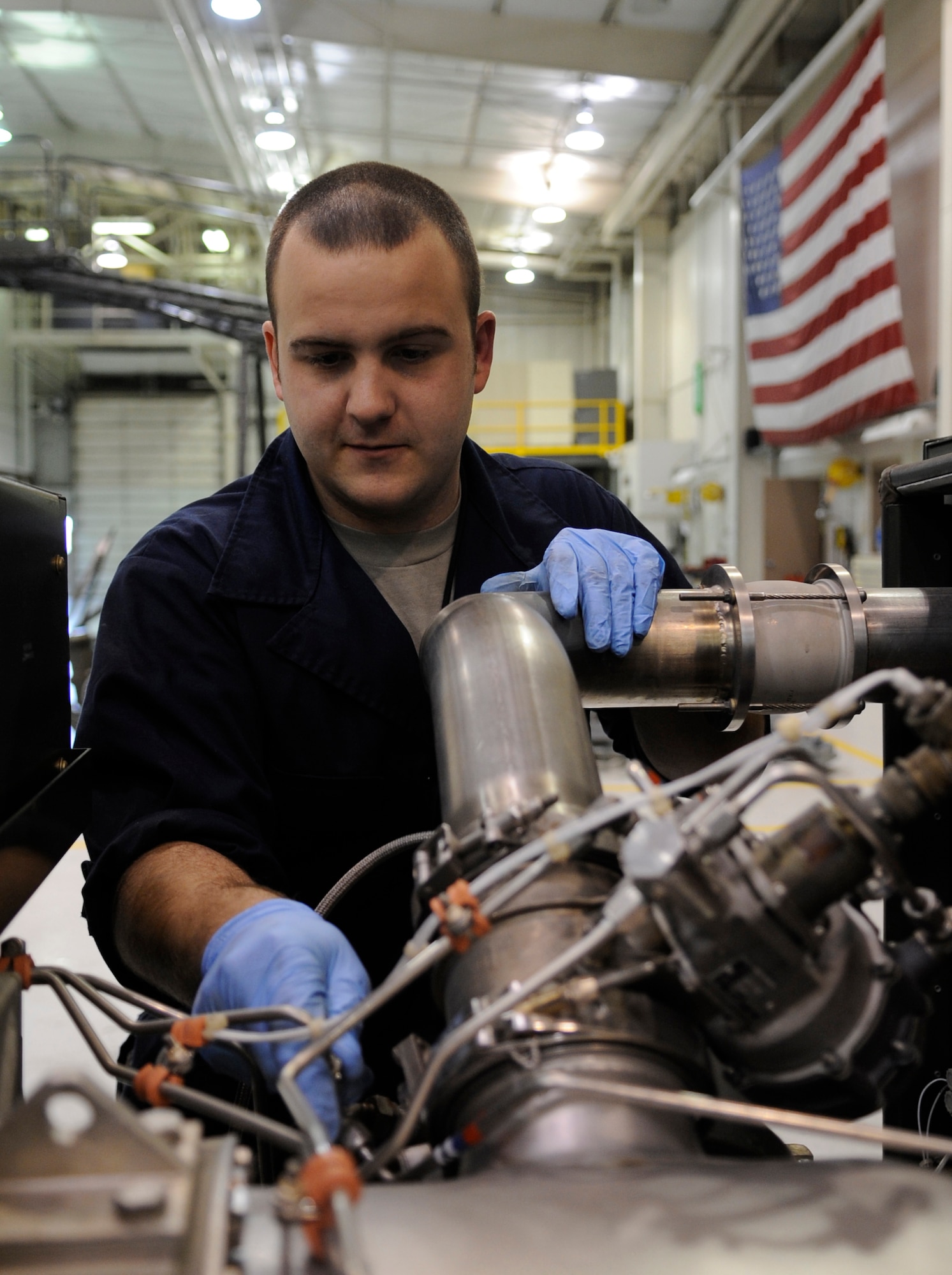 WHITEMAN AIR FORCE BASE, MO. – Staff Sgt. Cole Adams, 509th Maintenance Squadron aerospace ground equipment mechanic, tightens bolts on a -95 air start cart gas turbine compressor here Jan. 31. The gas turbine is an internal combustion engine that uses air as the working fluid. The engine extracts chemical energy from fuel and converts it to mechanical energy using the gaseous energy of the working fluid to drive the engine and propeller, which, in turn, propel the aircraft. (U.S. Air Force photo/Staff Sgt. Alexandra M. Boutte) (RELEASED)