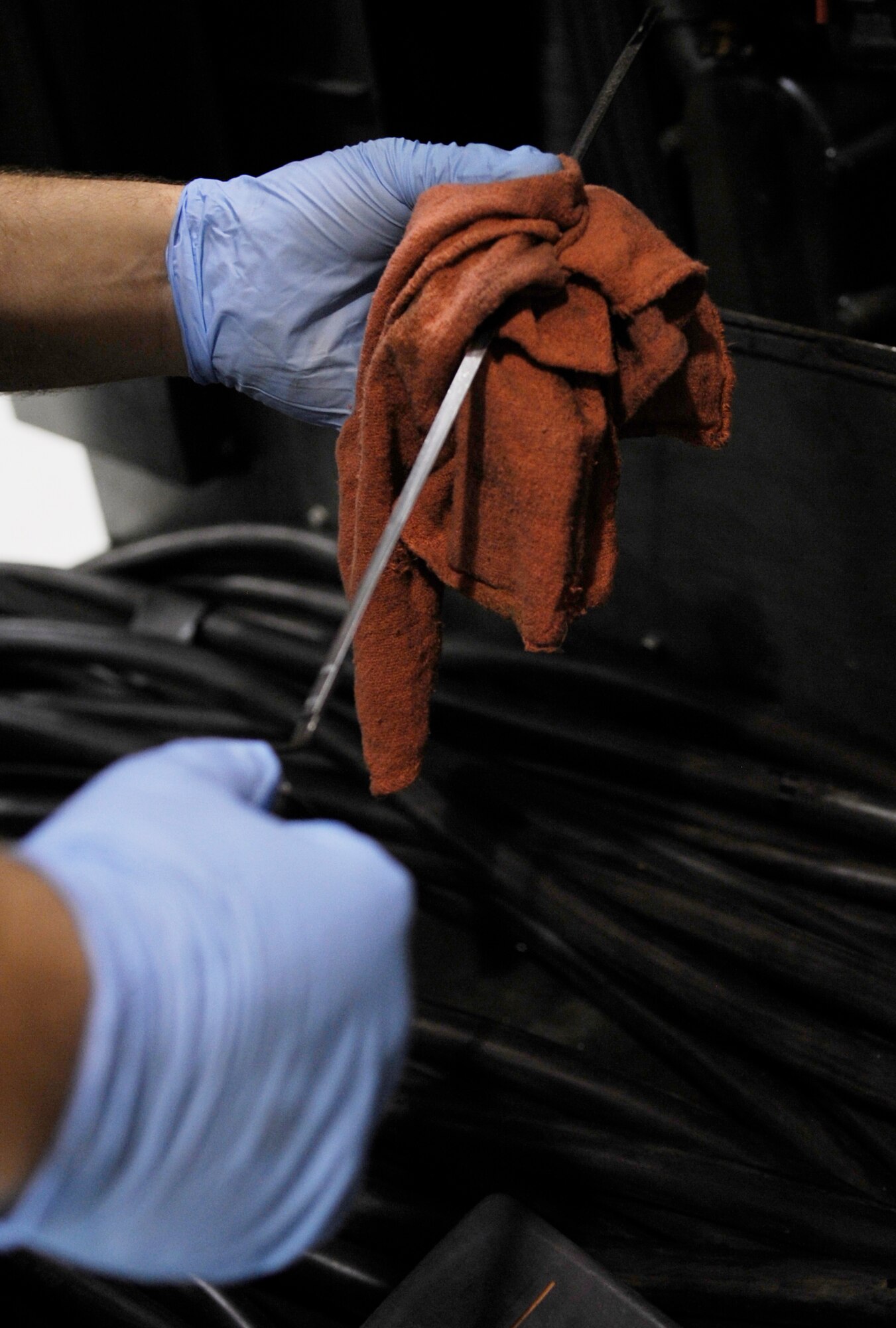 WHITEMAN AIR FORCE BASE, MO. – Staff Sgt. Cole Adams, 509th Maintenance Squadron aerospace ground equipment mechanic, cleans the dip-stick of a -86 diesel generator here Jan. 29. The diesel generator supplies power to systems used in support of flightline maintainers. (U.S. Air Force photo/Staff Sgt. Alexandra M. Boutte) (RELEASED)