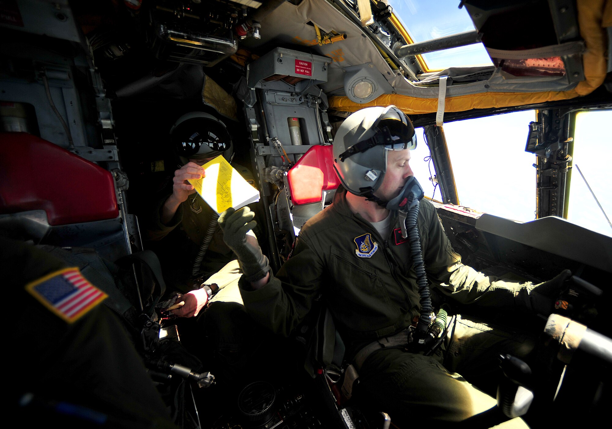 U.S. Air Force  Capt. Benjamin Visser, a B-52 pilot with the 2nd Bomber Wing, hands a checklist to another pilot during a mission in support of Cope North 13 near Anderson Air Force Base, Guam, Feb. 7, 2013. Cope North is an annual air combat tactics, humanitarian assistance and disaster relief exercise designed to increase the readiness and interoperability of the U.S. Air Force, Japan Air Self-Defense Force and Royal Australian Air Force.. (U.S. Air Force photo by Senior Airman Matthew Bruch/RELEASED)
