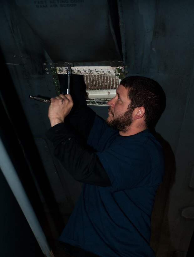 Brandon Simmons, 28th Aircraft Maintenance Squadron contract field team aircraft mechanic, removes an access panel on a B-1 during a home station maintenance check at Ellsworth Air Force Base, S.D., Jan. 22, 2013. This B-1 recently returned from Southwest Asia and needed to be inspected for cracks per established maintenance guidelines as part of preparing the aircraft for future operations. (U.S. Air Force photo by Airman 1st Class Alystria Maurer/Released)