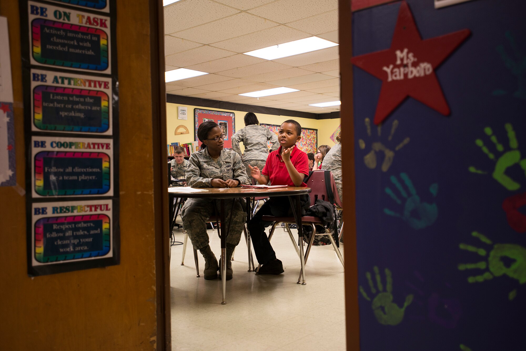 Airman 1st Class Mimi Greasham, a 19th Comptroller Squadron financial technician, helps a third grade student, with his math homework during a tutoring session, Feb. 1, at Arnold Drive Elementary School. Greasham is a point of contact for the Soaring Stars Mentorship Program. The Soaring Stars Mentorship Program allows Airmen to tutor and mentor Arnold Drive Elementary students every Thursday. (U.S. Air Force photo by Airman 1st Class Regina Agoha)