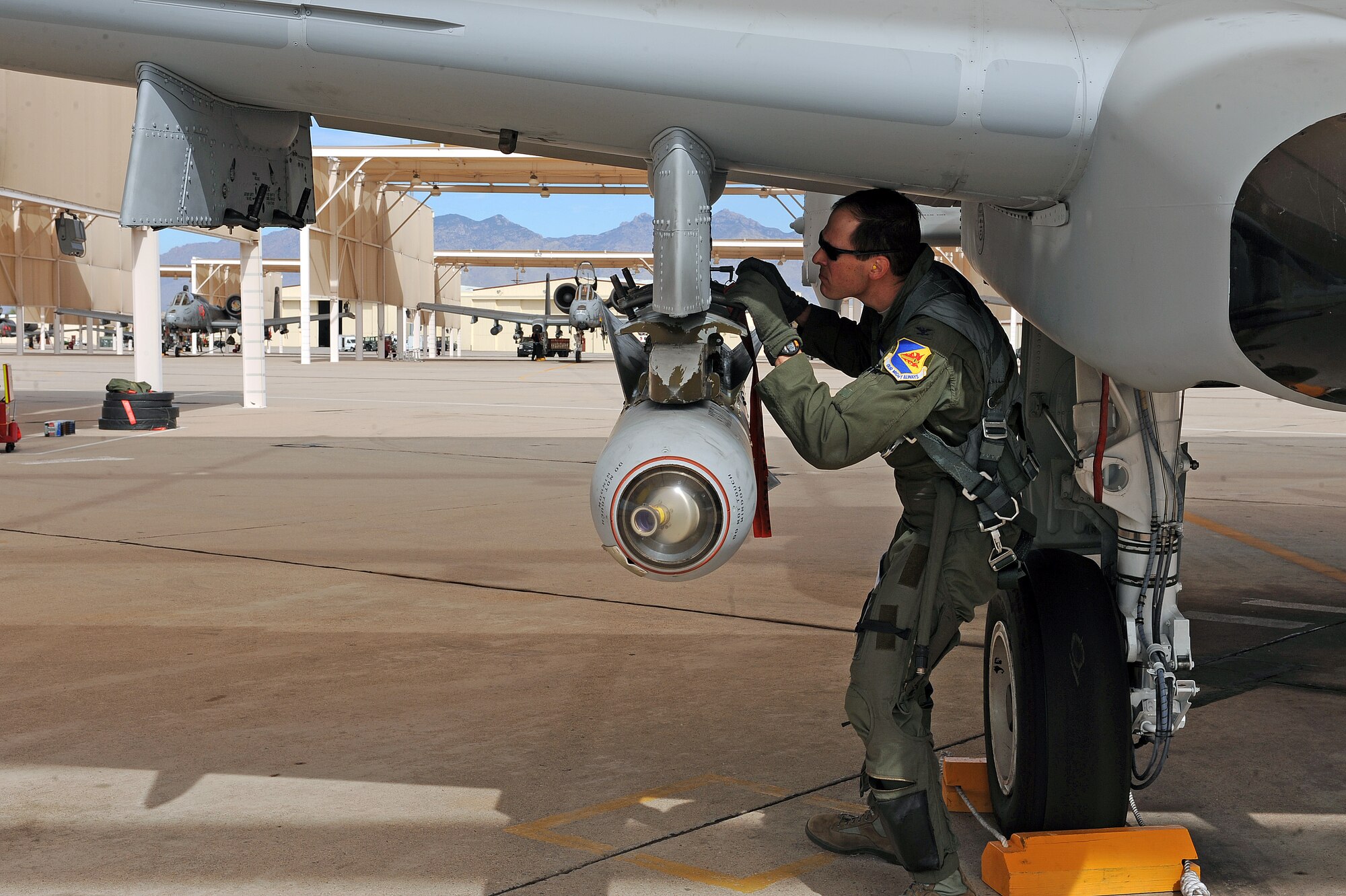 U.S. Air Force Col. James Meger, 355th Fighter Wing vice commander, performs his pre-flight inspection on an A-10 aircraft on the flightline on Davis-Monthan Air Force Base, Ariz. Feb. 4, 2013. (U.S. Air Force photo by Airman 1st Class Christine Griffiths/Released)