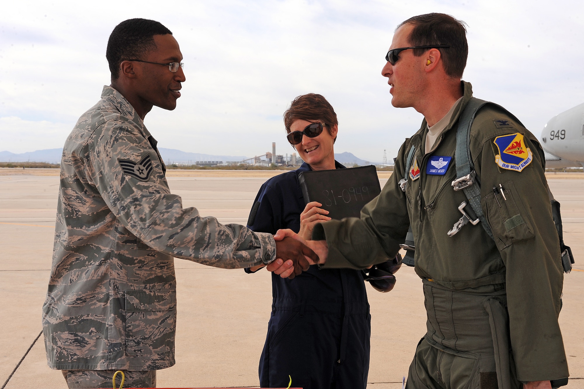 U.S. Air Force Staff Sgt. Kyle Pickens, 355th Aircraft Maintenance Squadron, greets Col. James Meger, 355th Fighter Wing vice commander, before initial pre-flight checks on the flightline on Davis-Monthan Air Force Base, Ariz. Feb. 4, 2013. Crew chiefs are responsible for keeping their aircraft maintained to the high Air Force standards. (U.S. Air Force photo by Airman 1st Class Christine Griffiths/Released)