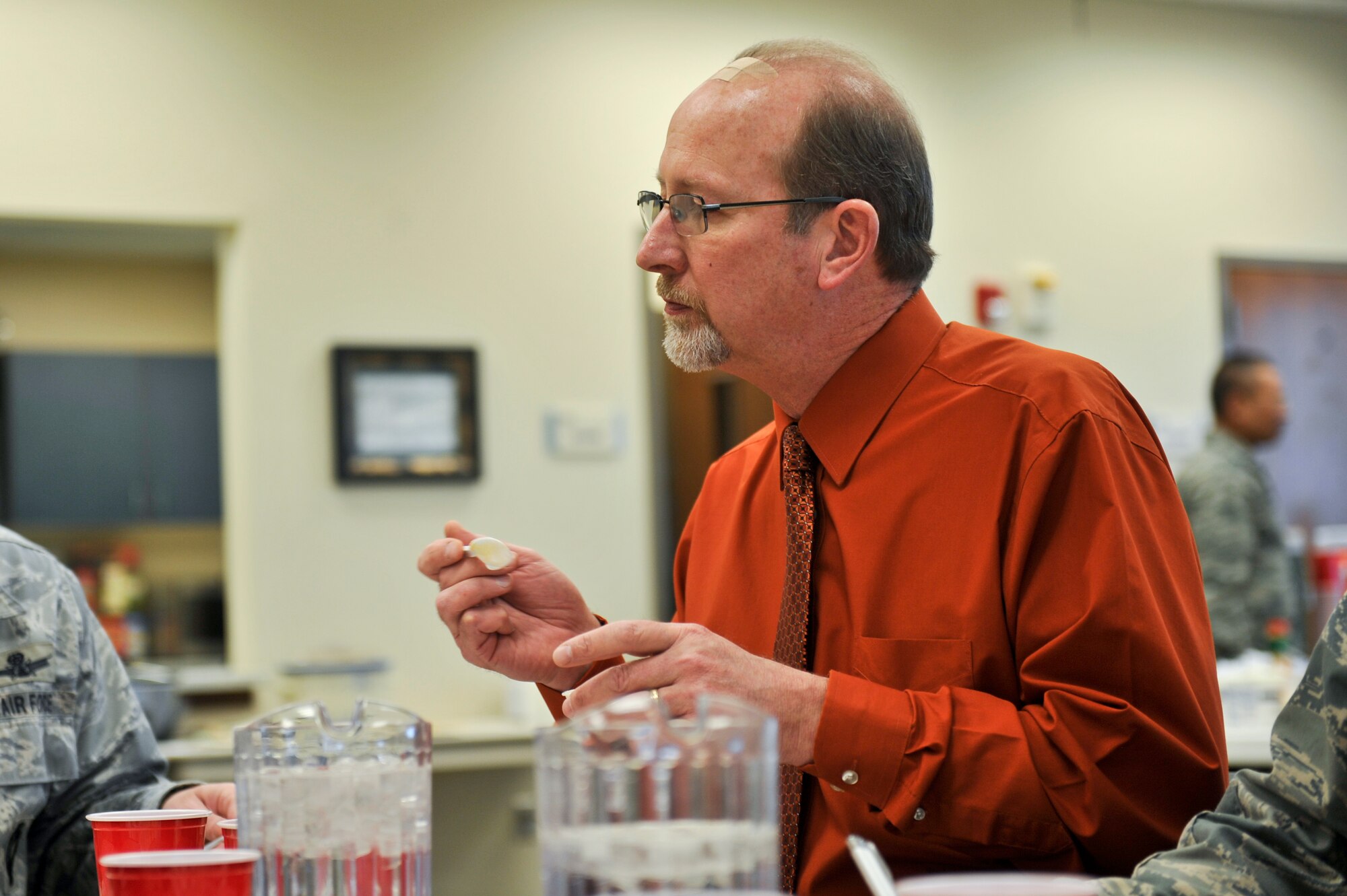 Duane Judy, 460th Space Wing Anti-terrorism Office, tastes a unique chili recipe at the 10th Annual Chili Cook-Off hosted by the Buckley Air Force Base Chapel Feb. 6, 2013, at the chapel Fellowship Hall. Judy was one of six judges. The winning recipe for the most unique category was a cactus chili.  (U.S. Air Force photo by Airman 1st Class Riley Johnson/Released)