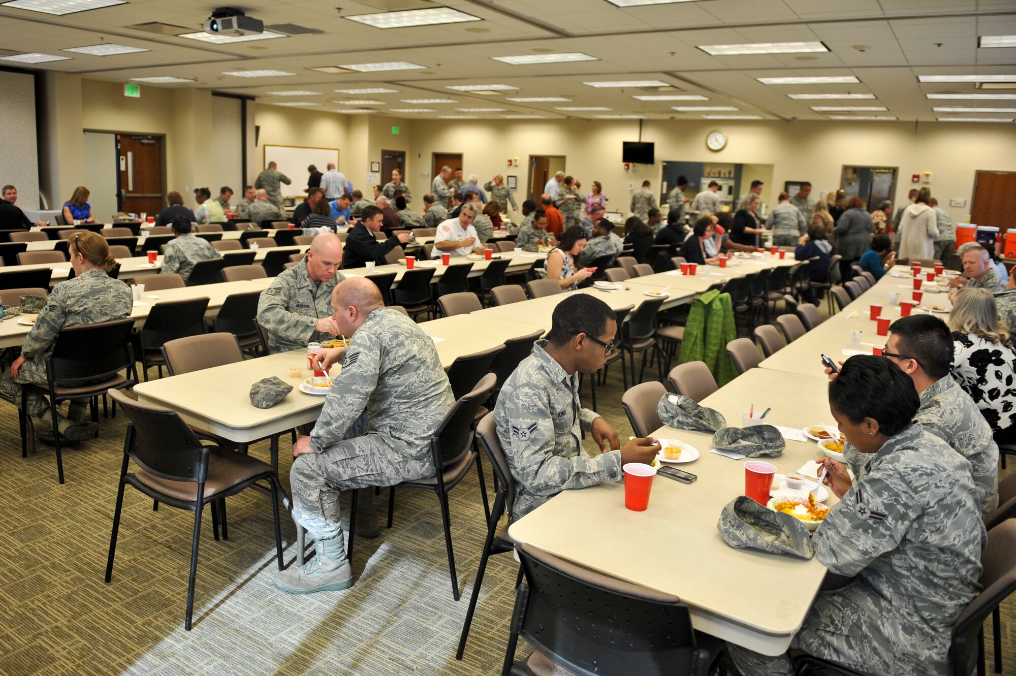 Team Buckley members eat chili at the 10th Annual Chili Cook-Off hosted by the Buckley Air Force Base Chapel Feb. 6, 2013, at the chapel Fellowship Hall. More than 100 people turned out to partake in the chili after the competition. Following the cook-off, a short devotion was given as part of the monthly chapel luncheon. (U.S. Air Force photo by Airman 1st Class Riley Johnson/Released)