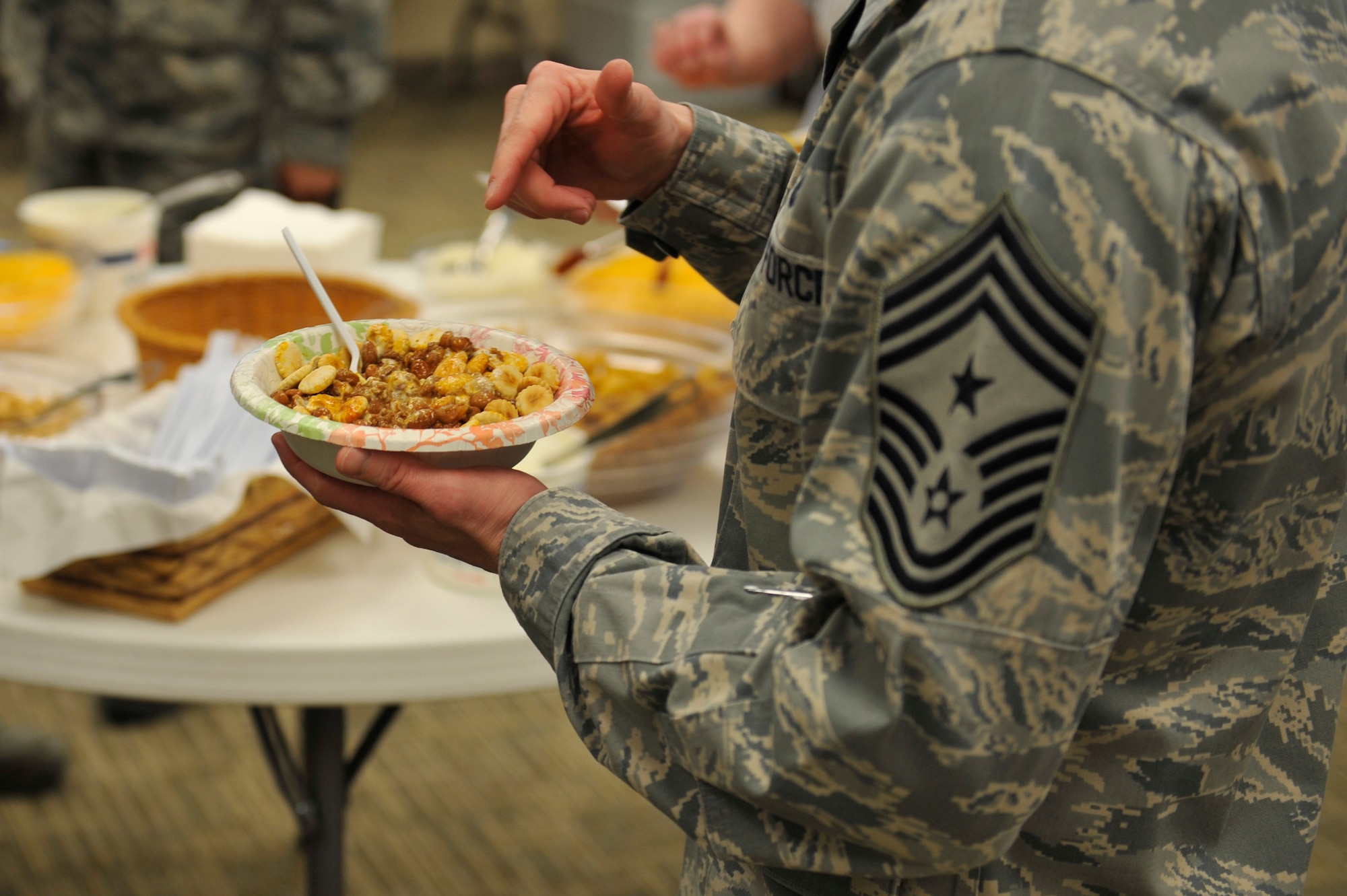Chief Master Sgt. William Ward, 460th Space Wing command chief, samples a bowl of chili at the 10th Annual Chili Cook-Off hosted by the Buckley Air Force Base Chapel Feb. 6, 2013, at the chapel Fellowship Hall. Following the chili cook-off, Team Buckley members were invited to partake in the chili as part of the monthly chapel luncheon. (U.S. Air Force photo by Airman 1st Class Riley Johnson/Released)