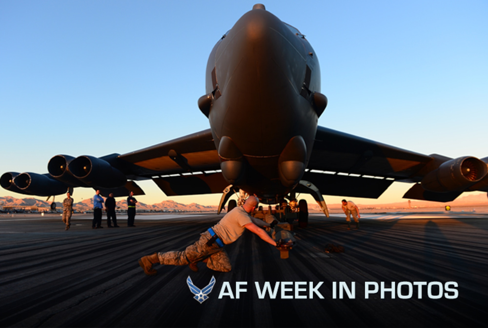 Senior Airman John Myer, 2nd Aircraft Maintenance Squadron, B-52 aircraft maintainer, Barksdale Air Force Base, La., pushes a tow bar under a B-52H Stratofortress tire during a Red Flag exercise, Nellis Air Force Base, Nev., Jan. 2013. The B-52 shredded a tire upon landing after a four-hour mission. (U.S. Air Force photo/Staff Sgt. Vernon Young Jr.)
