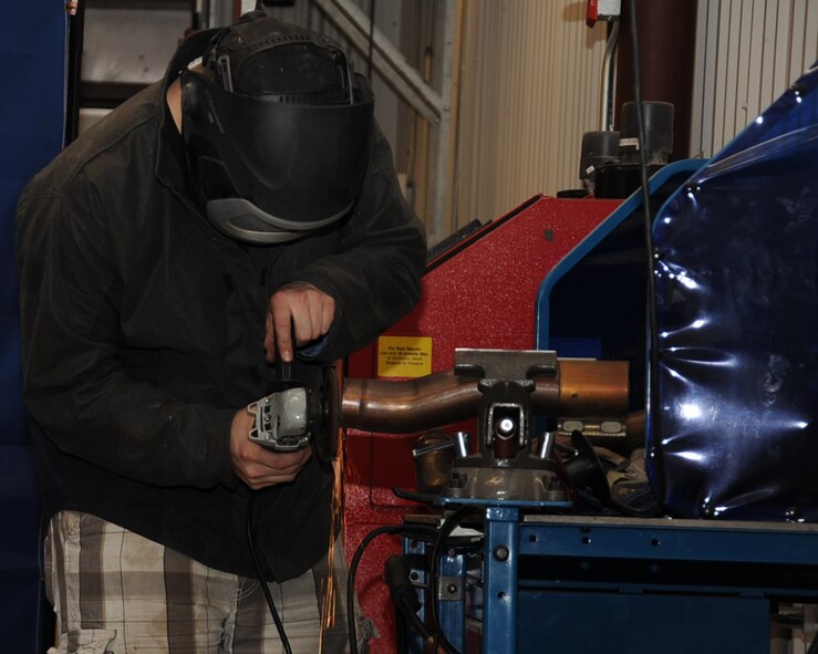 Senior Airman Timothy Moore, 2nd Maintenance Squadron electrical environmental journeyman, welds part of catback exhaust at the Auto Hobby Shop on Barksdale Air Force Base, La., Feb. 7. The shop provides various tools and equipment used for care maintenance. (U.S. Air Force photo/Senior Airman Sean Martin)