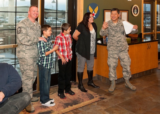 Col. H.B. Brual, former 341st Missile Wing commander, recognizes Rhonda Hall, wife of Senior Master Sgt. Jerry Hall, 341st Communications Squadron first sergeant, (left), as the Air Force Association Joan Orr Spouse of the Year recipient for Air Force Global Strike Command during a ceremony at the Grizzly Bend on Jan. 24. Hall received the award after donating nearly 900 volunteer hours at more than 49 events and raised more than $15,000 for the base and Great Falls community. (U.S. Air Force photo/Beau Wade)