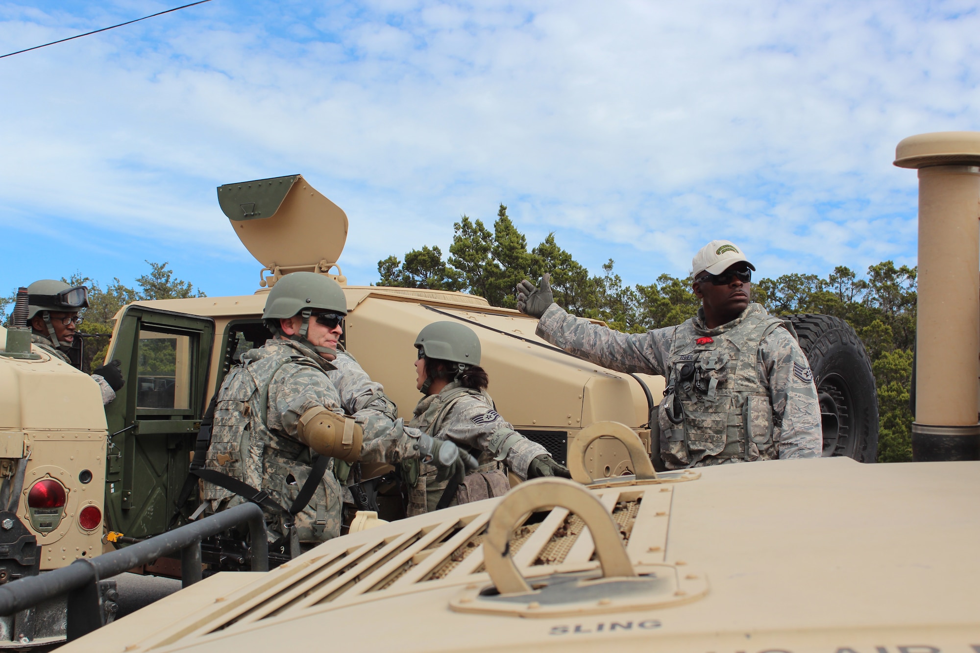 Staff Sgt. Earl Fisher, Jr., Combat Airman Skills Training instructor, shows students how to conduct a safety load of personnel into a vehicle during training, Feb. 5, 2013 at Camp Anderson-Peters, Texas. Fisher is one of approximately 20 instructors at Camp AP and has been instructing for more than eight months. (U.S. Air Force photo/Tech. Sgt. Jason Wells)