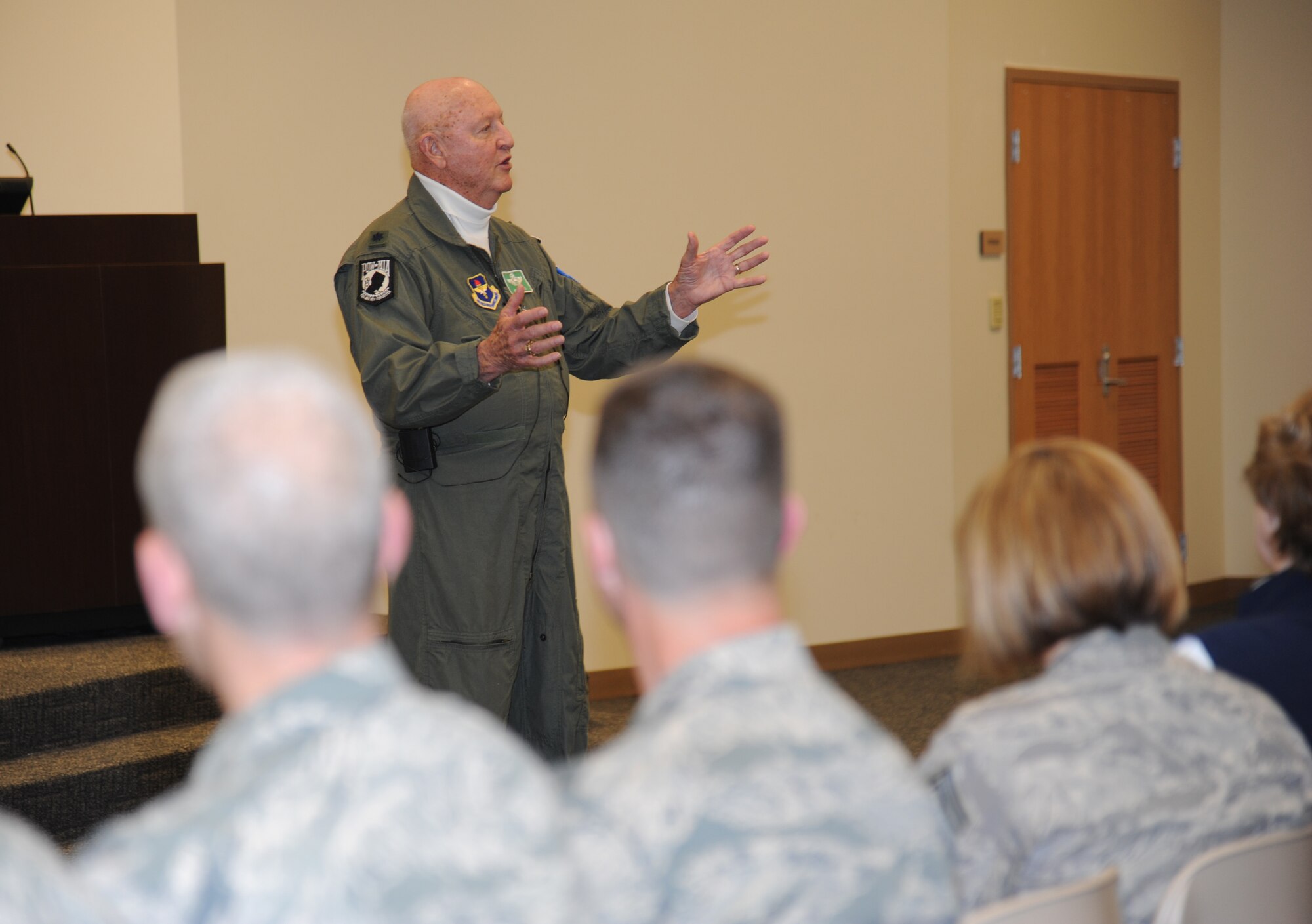 Retired Lt. Col. John “Jack” Yuill, a former prisoner of war in North Vietnam, speaks to Airmen during an “all call” with base personnel Feb. 5, 2013, at the Roberts Consolidated Aircraft Maintenance Facility, Keesler Air Force Base, Miss.  Yuill was interned as a POW after he was shot down Dec. 22, 1972, and was held until his release on March 29, 1973.  (U.S. Air Force photo by Kemberly Groue)