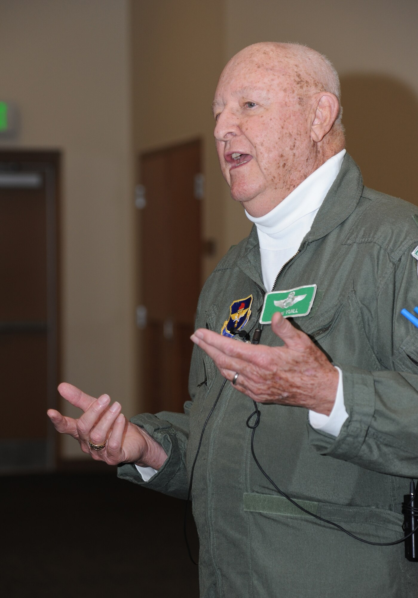 Retired Lt. Col. John “Jack” Yuill, a former prisoner of war in North Vietnam, speaks to Airmen during an “all call” with base personnel Feb. 5, 2013, at the Roberts Consolidated Aircraft Maintenance Facility, Keesler Air Force Base, Miss.  Yuill was interned as a POW after he was shot down Dec. 22, 1972, and was held until his release on March 29, 1973.  (U.S. Air Force photo by Kemberly Groue)