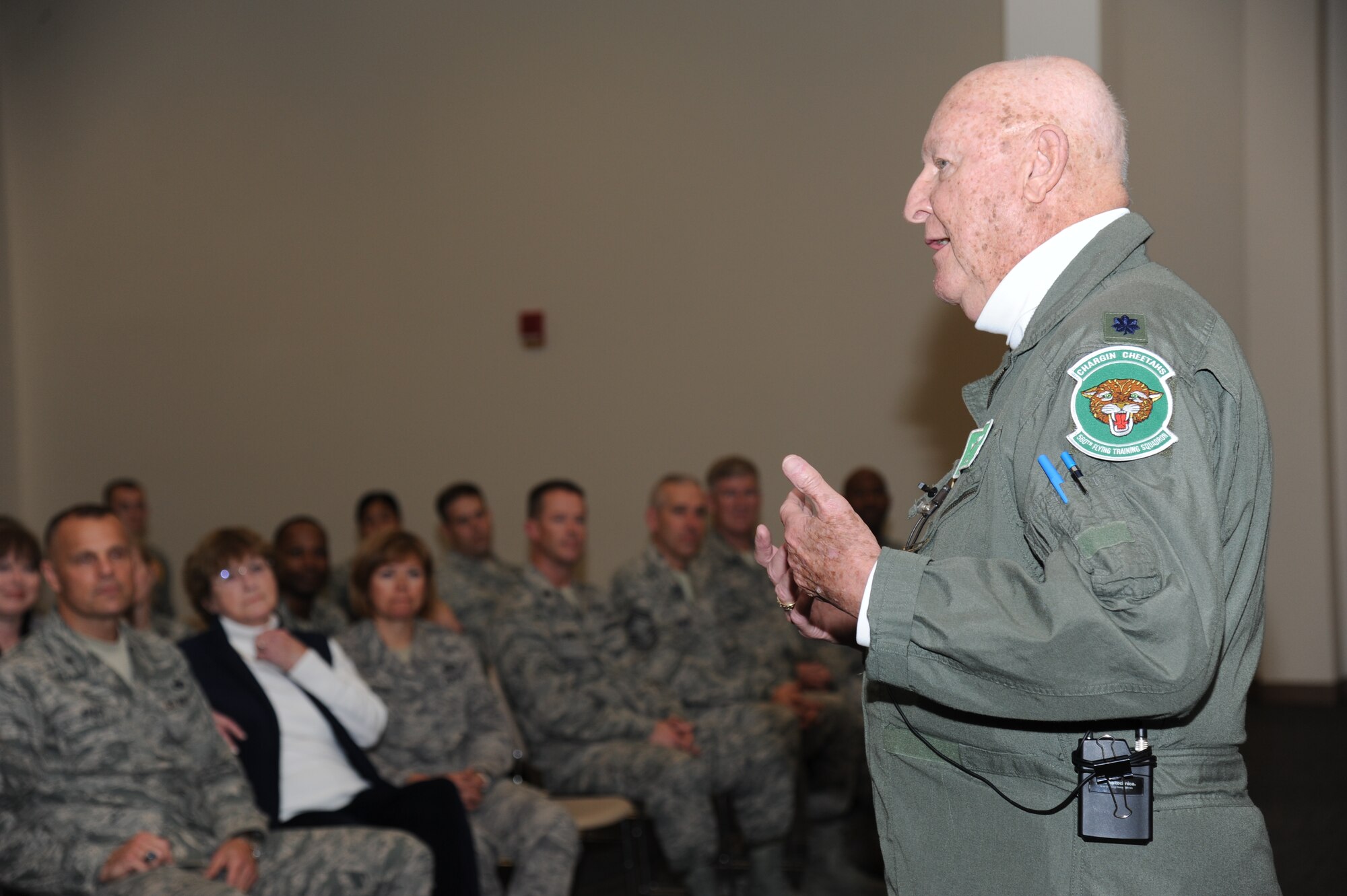 Retired Lt. Col. John “Jack” Yuill, a former prisoner of war in North Vietnam, speaks to Airmen during an “all call” with base personnel Feb. 5, 2013, at the Roberts Consolidated Aircraft Maintenance Facility, Keesler Air Force Base, Miss.  Yuill was interned as a POW after he was shot down Dec. 22, 1972, and was held until his release on March 29, 1973.  (U.S. Air Force photo by Kemberly Groue)