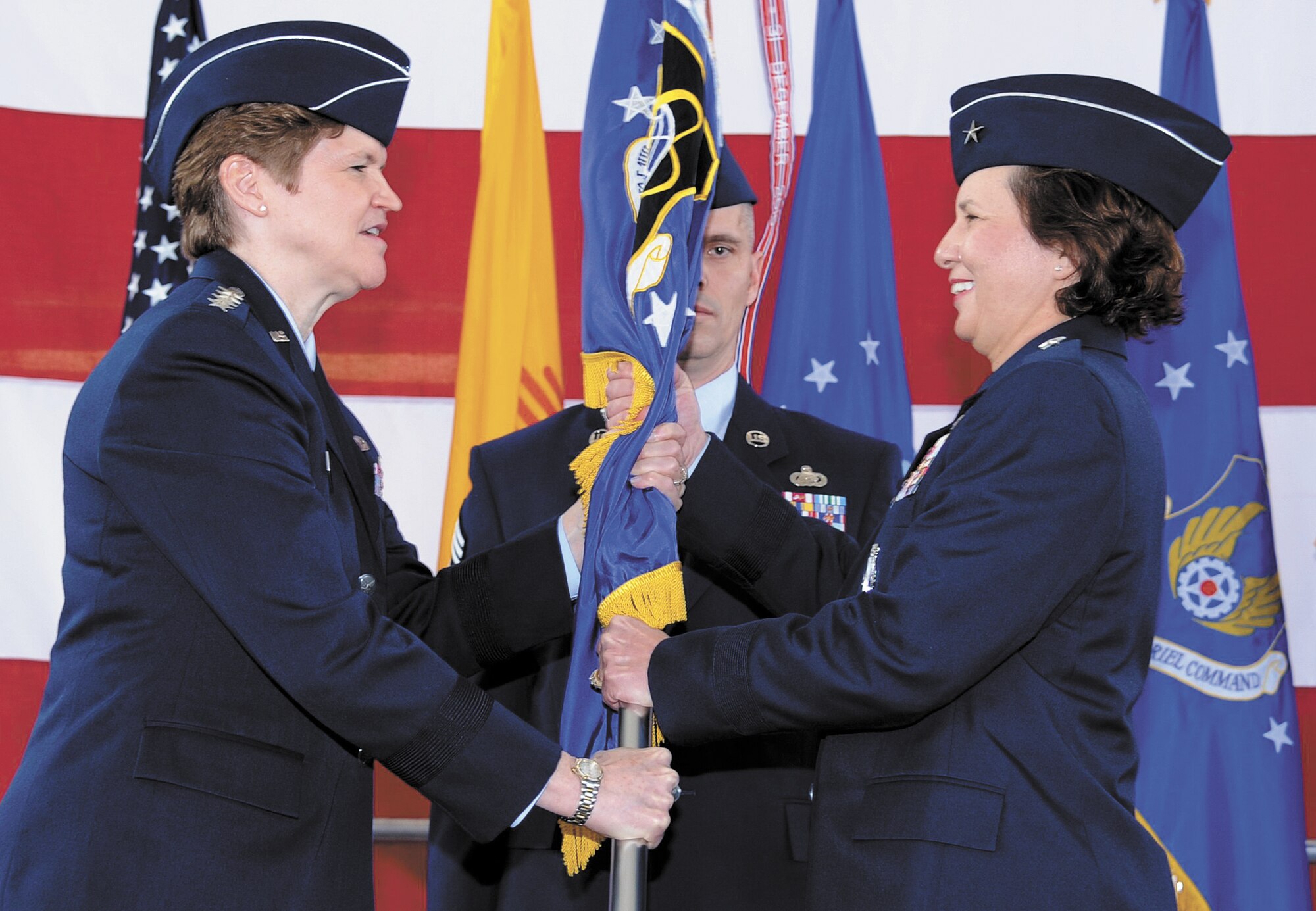 Brig. Gen. Sandra Finan, right, assumes command of the Air Force Nuclear Weapons Center in a ceremony here Feb. 7. Gen. Janet Wolfenbarger, commander of Air Force Materiel Command, left, was the presiding officer.   
