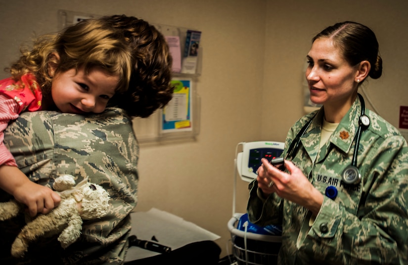 Maj. (Dr.) Tara Conner, 628th Medical Group pediatrician , conducts a routine checkup on two-year-old Olivia Feb. 1, 2013, at the 628th MSG Pediatrics  clinic at Joint Base Charleston – Air Base, S.C..  The 628th MDG support Airmen by supporting their families every day. Their mission is to guide, support and assist families through the physical, mental and emotional growth of children, as well as treating illness. Olivia is the daughter of Maj. Tami Miller, Family Nurse Practitioner flight commander. (U.S. Air Force photo / Airman 1st Class Tom Brading)  
