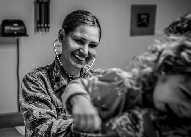 Maj. (Dr.) Tara Conner, 628th Medical Group pediatrician , conducts a routine checkup on two-year-old Olivia Feb. 1, 2013, at the 628th MDG Pediatrics  clinic at Joint Base Charleston – Air Base, S.C.  The 628th MDG pediatricians support Airmen by supporting their families every day. Their mission is to guide, support and assist families through the physical, mental and emotional growth of children, as well as treating illness. Olivia is the daughter of Maj. Tami Miller, Family Nurse Practitioner flight commander. (U.S. Air Force photo / Airman 1st Class Tom Brading)  